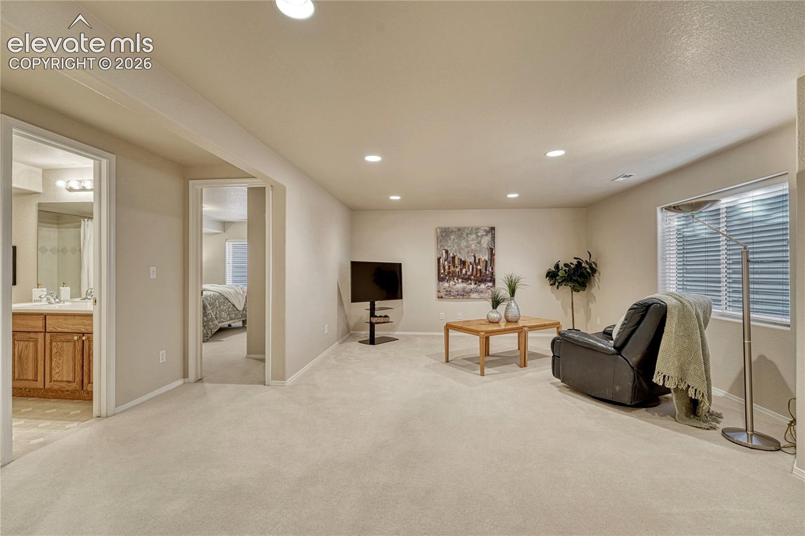 A massive finished basement family room offers endless possibilities for a home theater, game room, or recreation space
