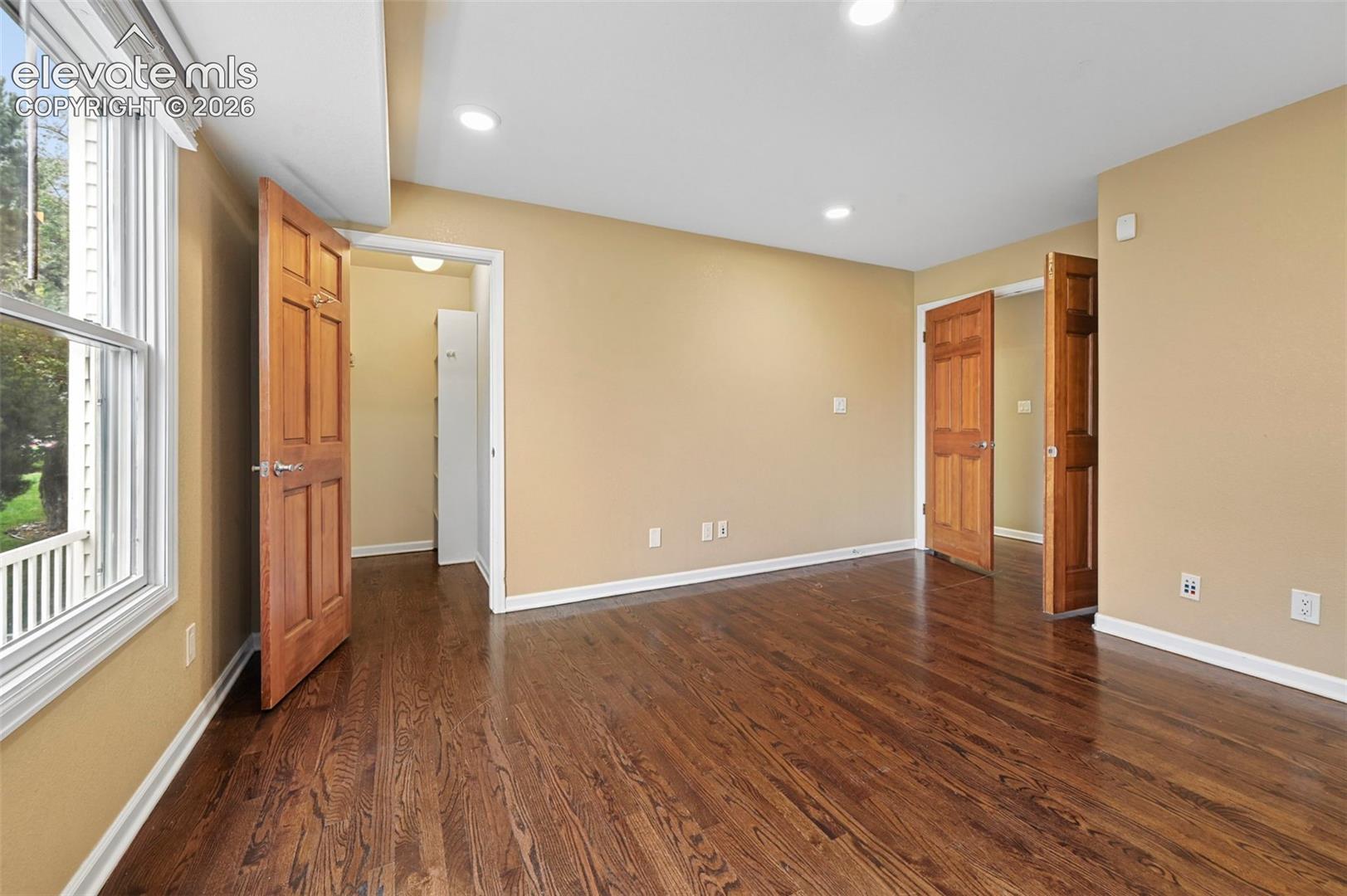 Office tucked behind classic double doors, could also serve as main level bedroom (6th bedroom)
