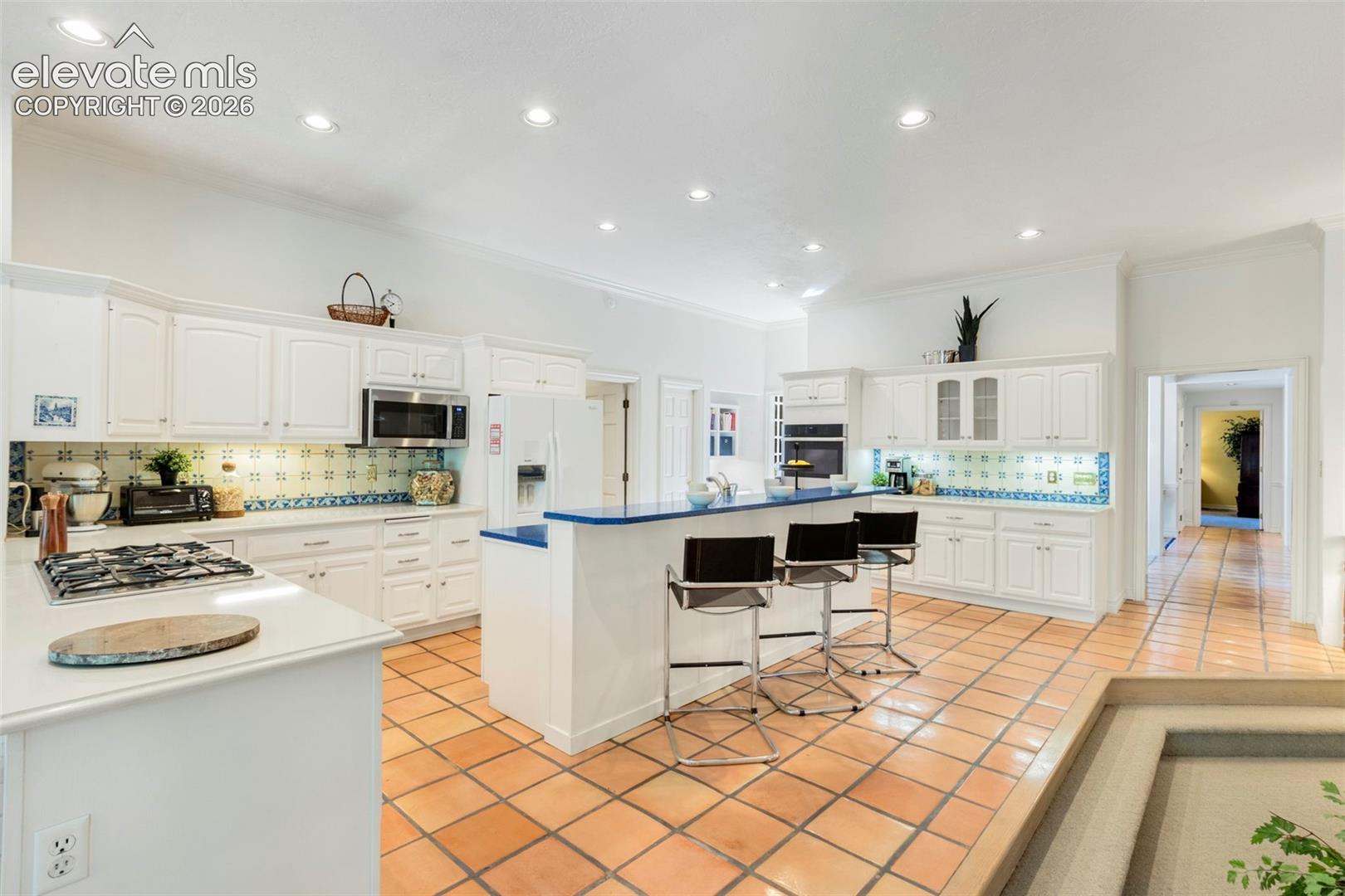 Breakfast bar, lots of cabinetry and counterspace