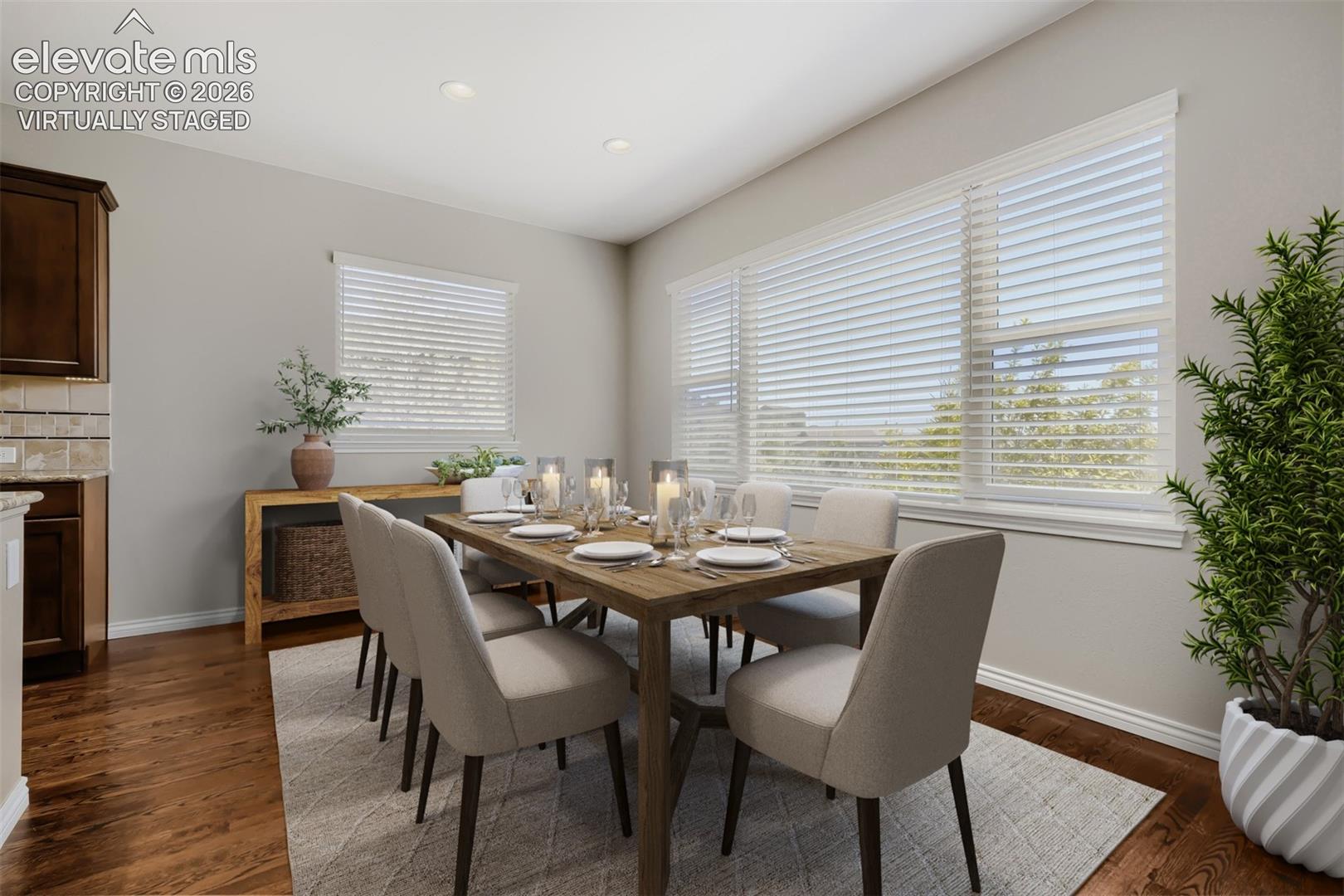 Virtually staged, beautiful dining room with spacious design, open concept floor plan, all out to deck and gorgeous wood floors.