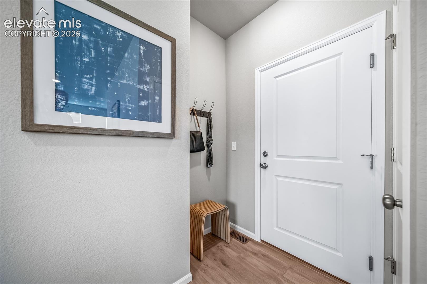 White paneled door with brushed nickel hardware
*photos of a model home*