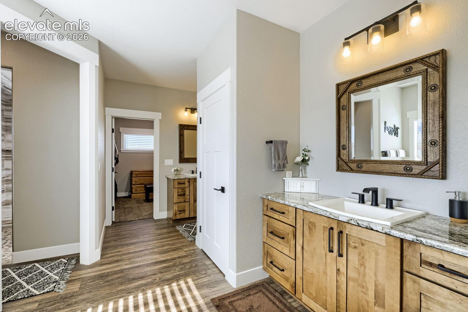 Wood-finish flooring with a light gray wall color