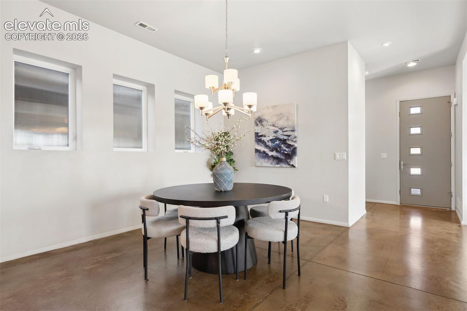 Dining room to entry showcasing the 8' Thermatru door