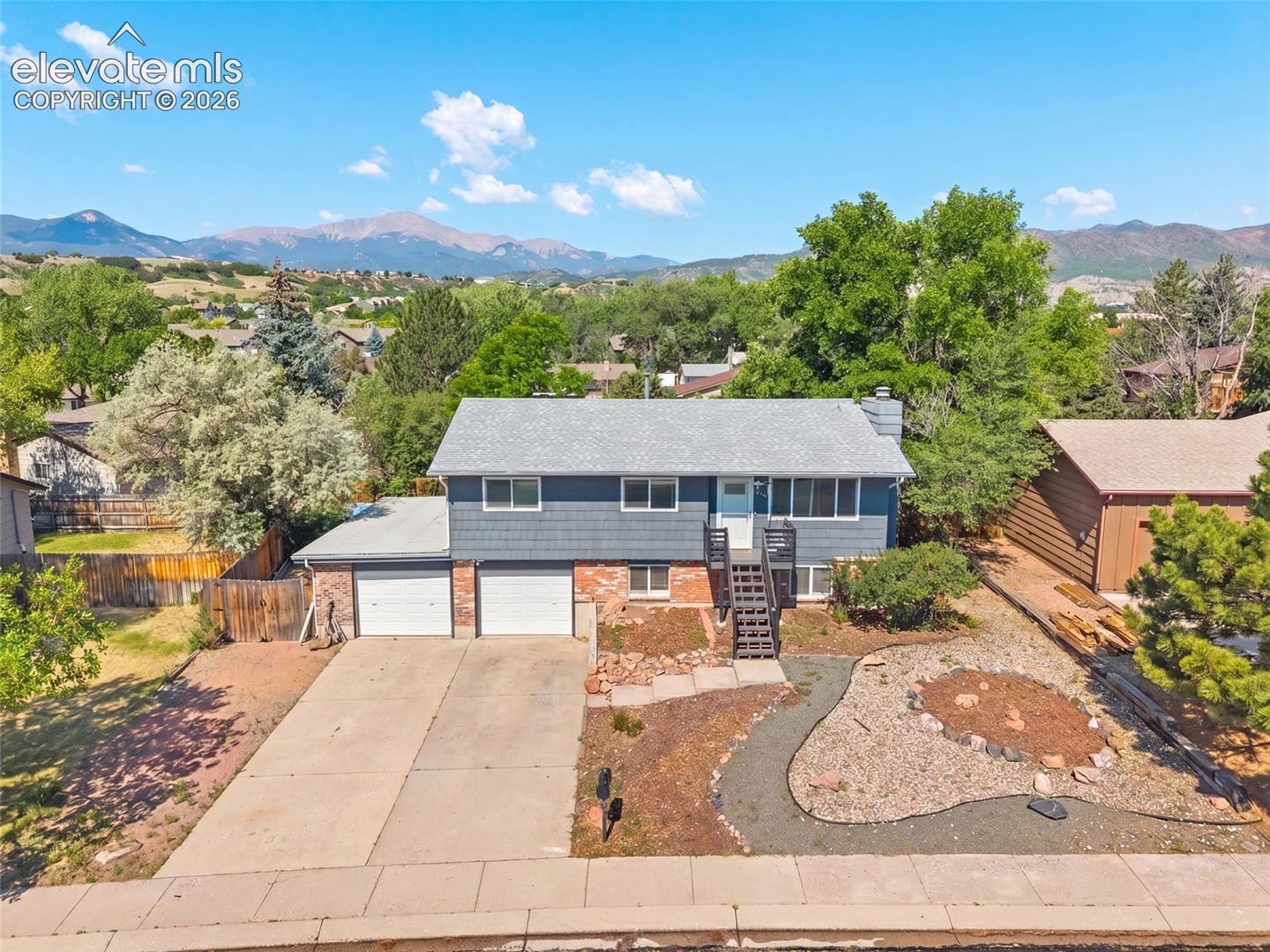 Aerial view showcasing the home and stunning mountain views.