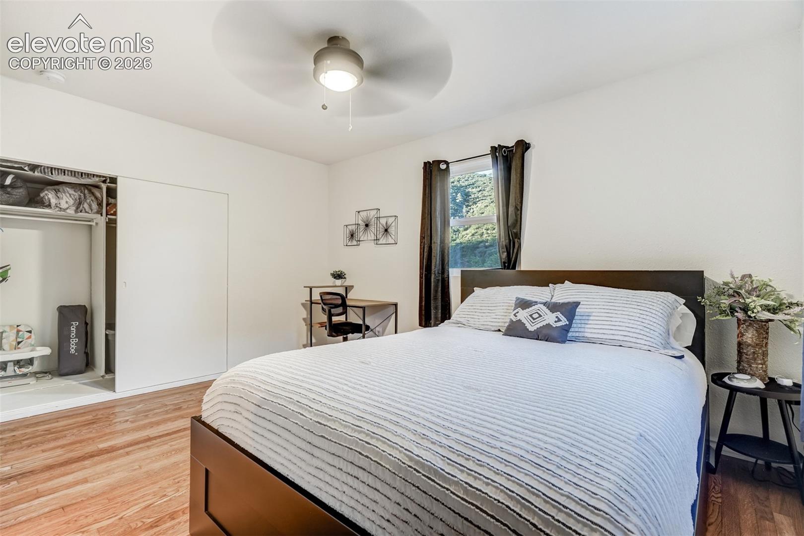 Recessed lighting, wood-finish flooring, ceiling fan, and sliding closet doors