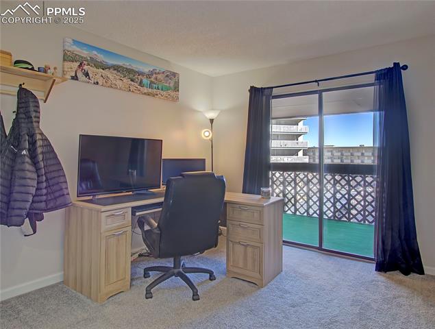 Second bedroom currently set up at an office