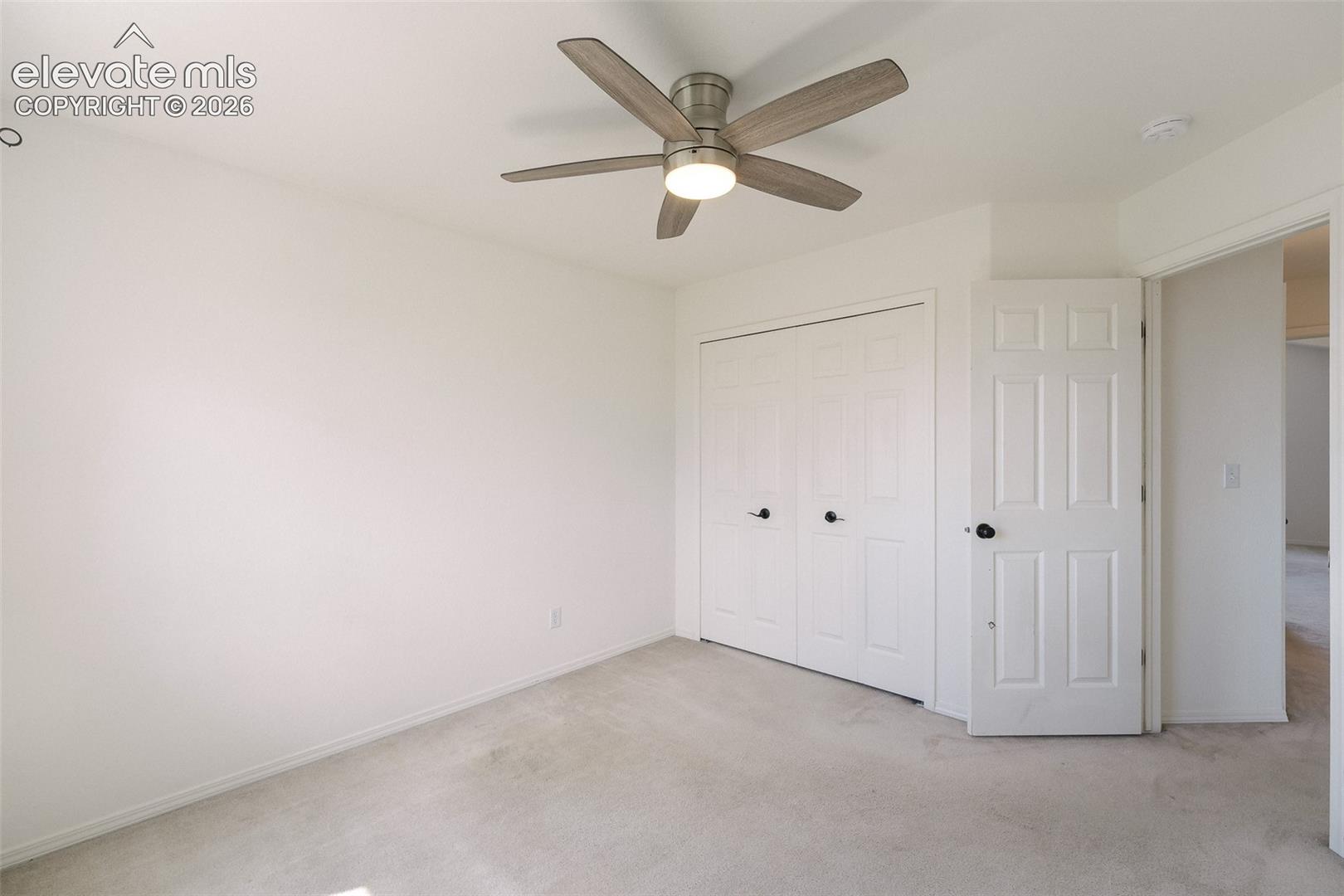 Neutral carpeting and light-colored walls