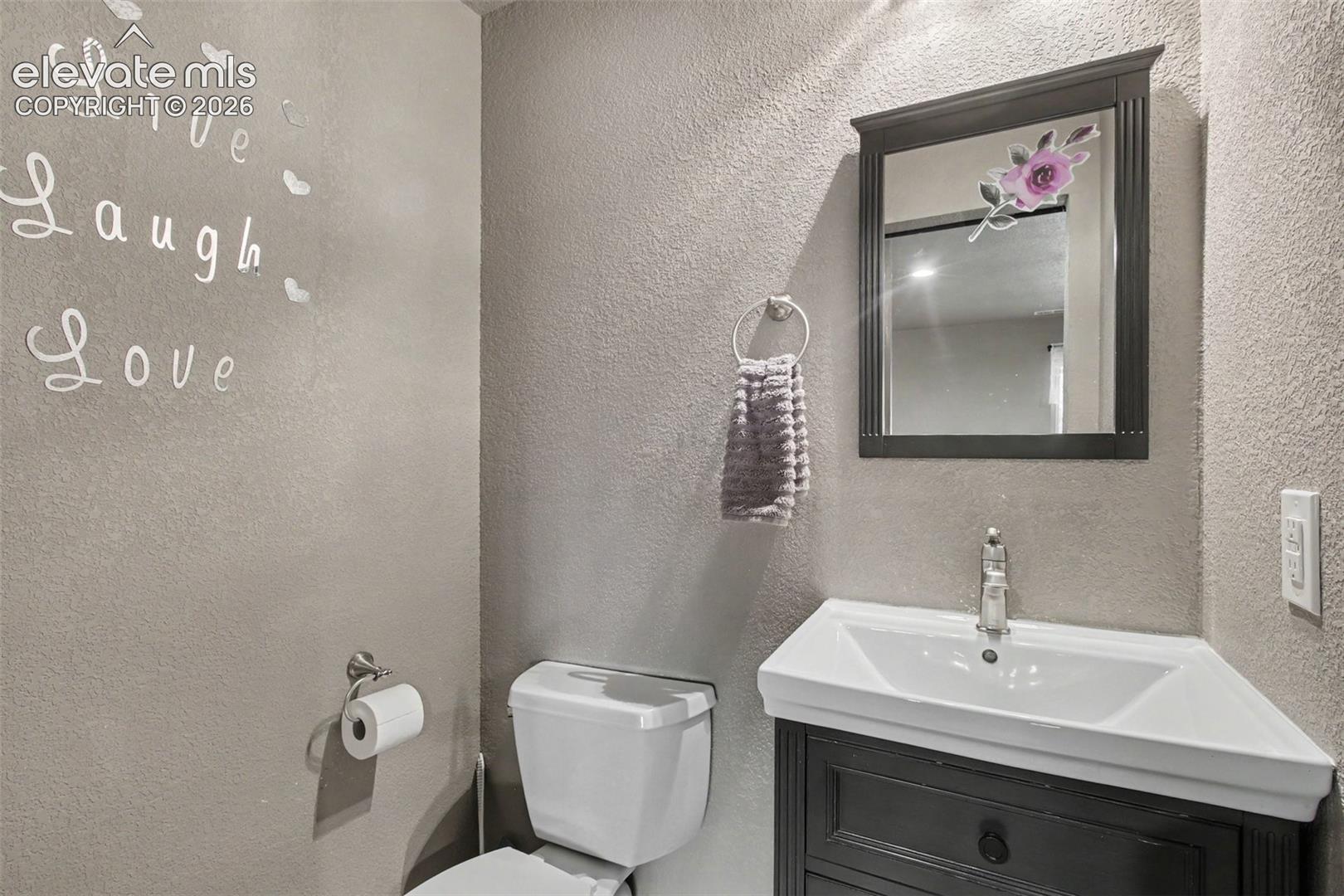 Conveniently located half bath with a clean, welcoming design—perfect for guests and everyday use.