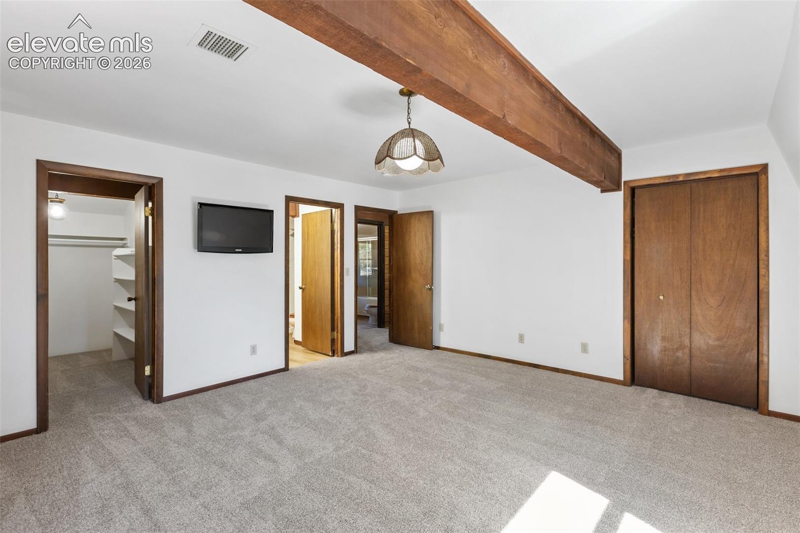 Spacious master with new paint, carpet, two large walk-in closets.