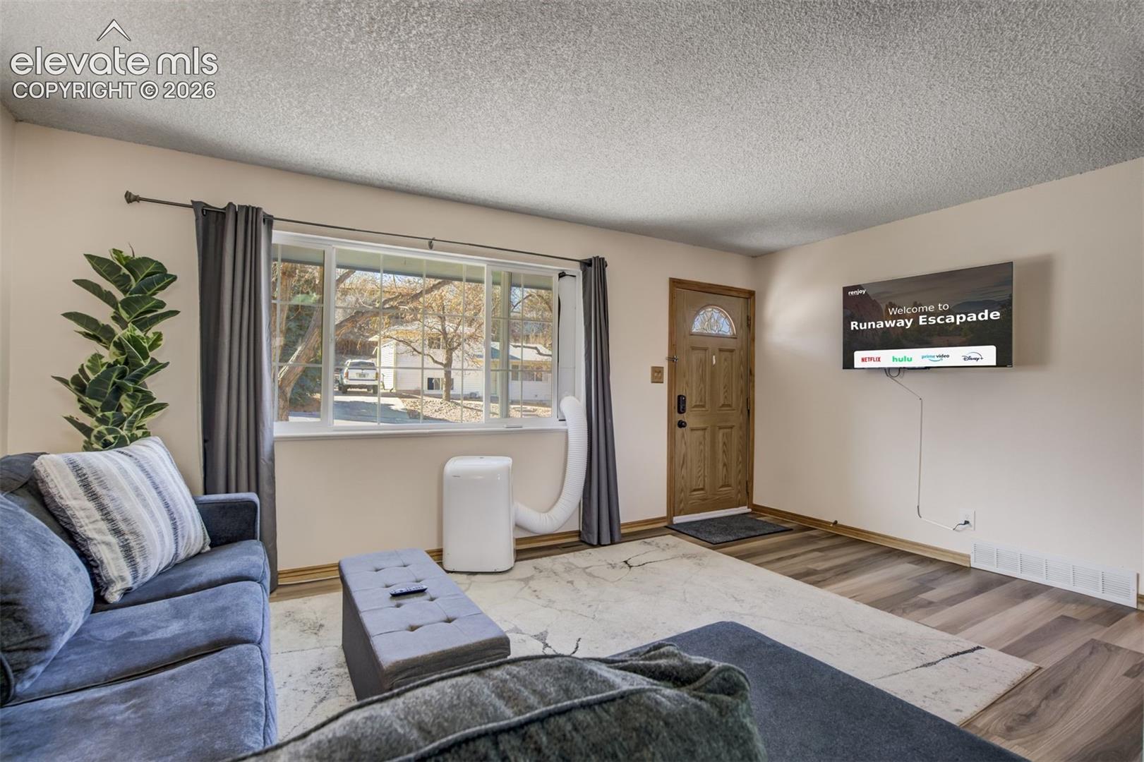 Wood-finish flooring throughout