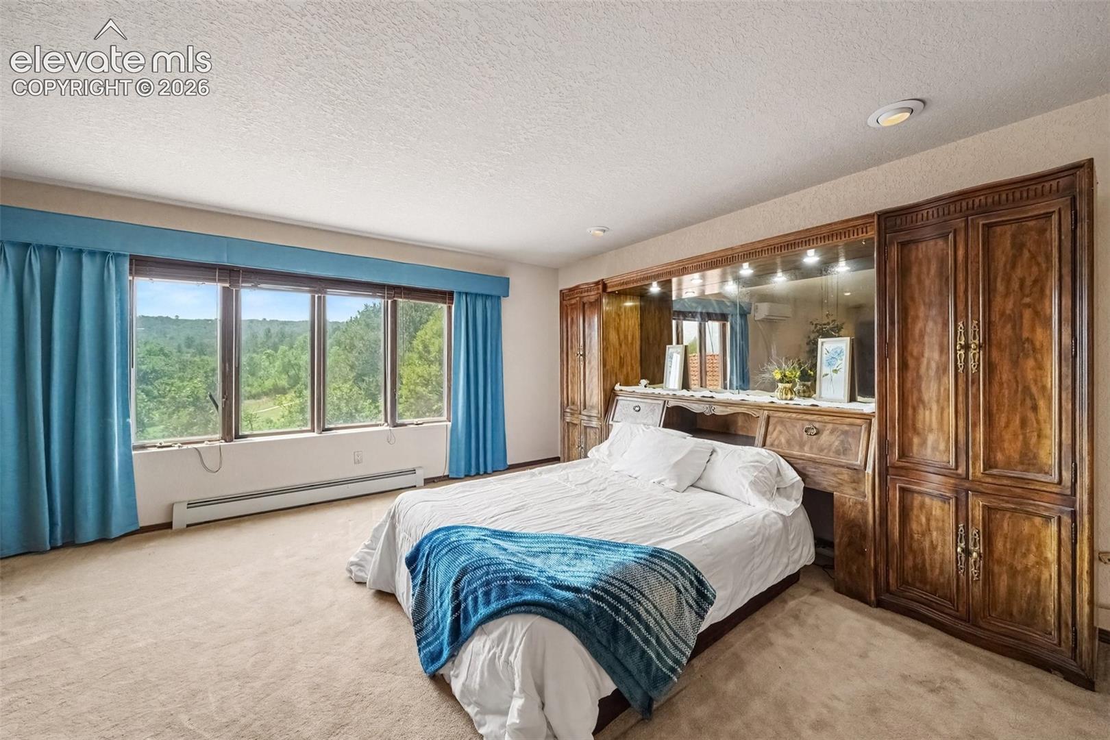Primary bedroom provides convenient access to the adjoining bathroom, creating a comfortable and private retreat