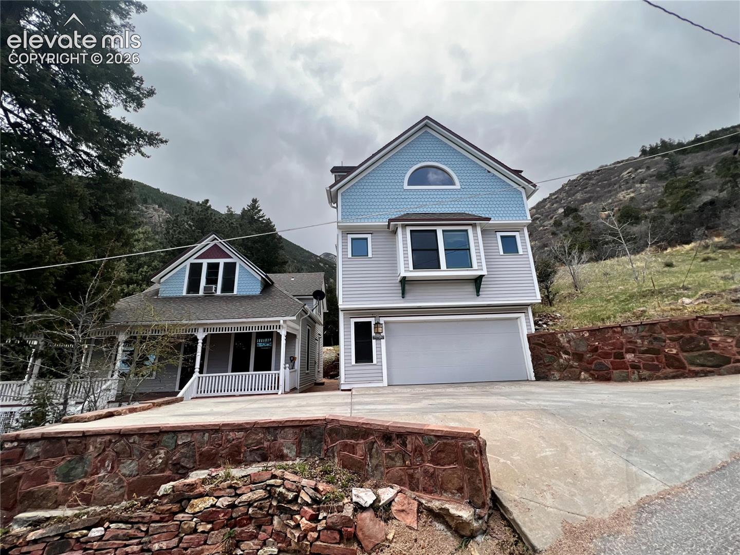  Custom Built Cottage on Right: 2 bd/1ba with new driveway addition allows for another off street parking spot. Custom cottage on the right adds a 2+ car garage
