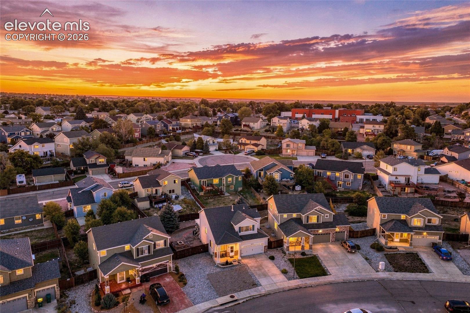 Residential neighborhood with varied architectural styles and mature landscaping
