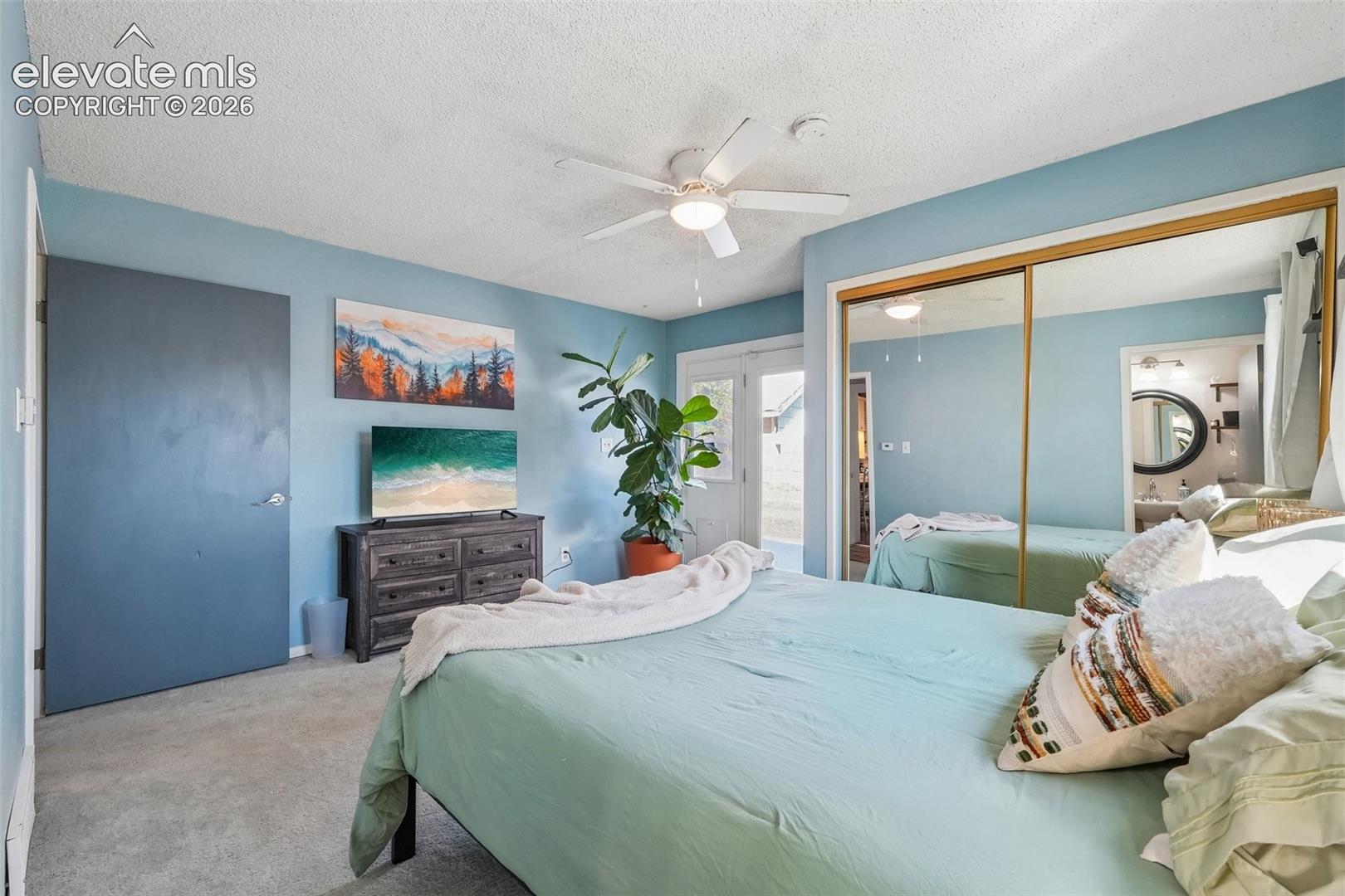 Primary bedroom with 3/4 en suite and a walk out to private deck