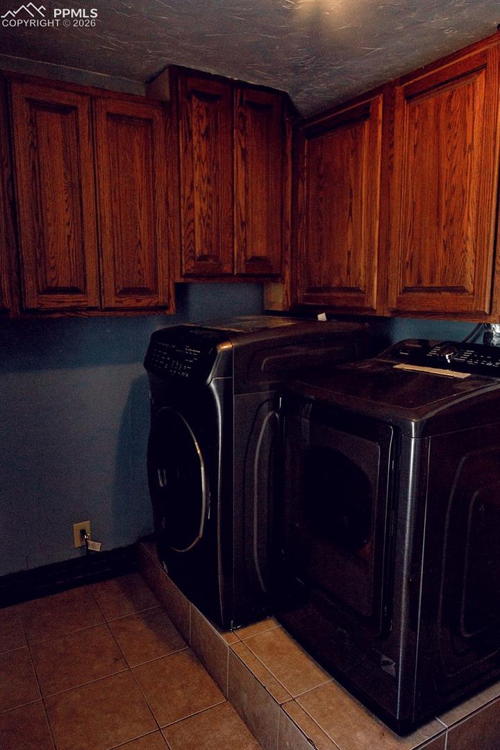 Upper Level Laundry Room with Cabinets