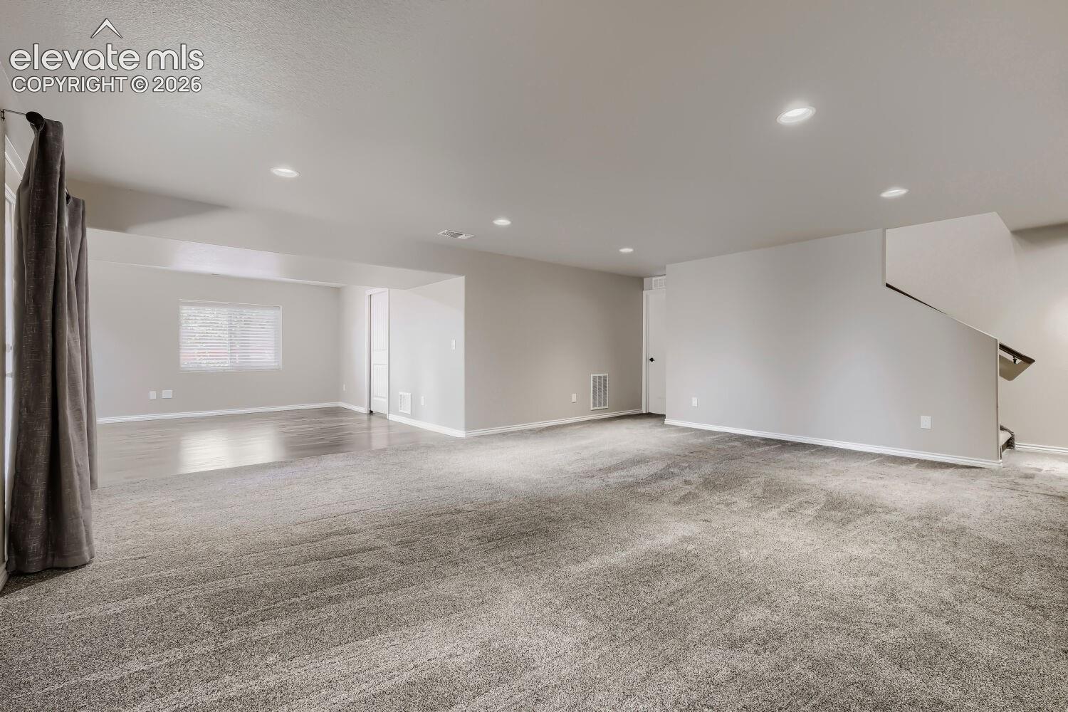 Basement family room with walkout, large rec room that can be game area, hobby area, playroom, or exercise room.