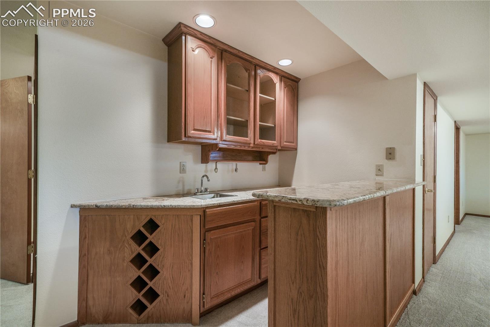 Basement mini bar, refrigerator included, granite countertops
