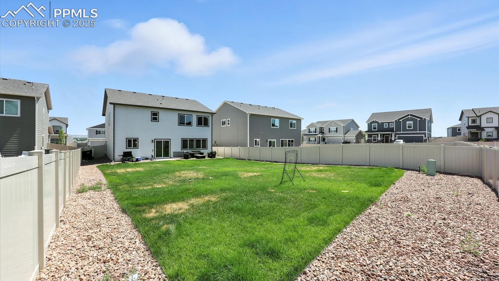 Large fenced backyard.
