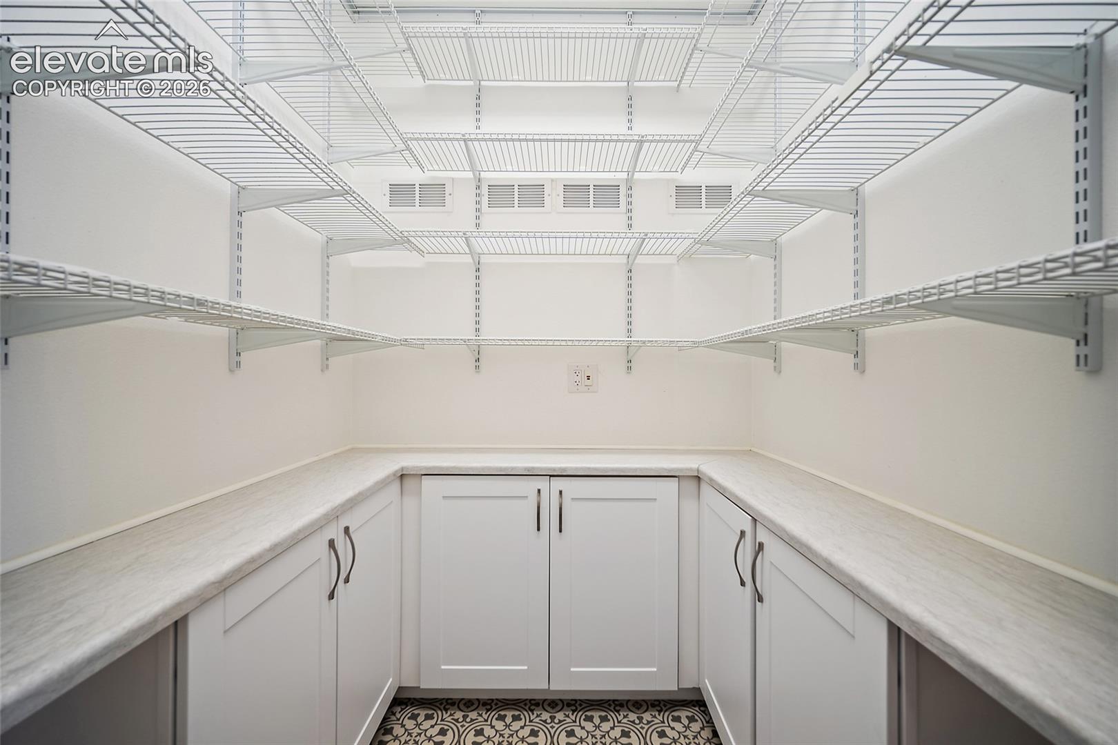 Custom Pantry with plenty of storage.  This was the laundry room
