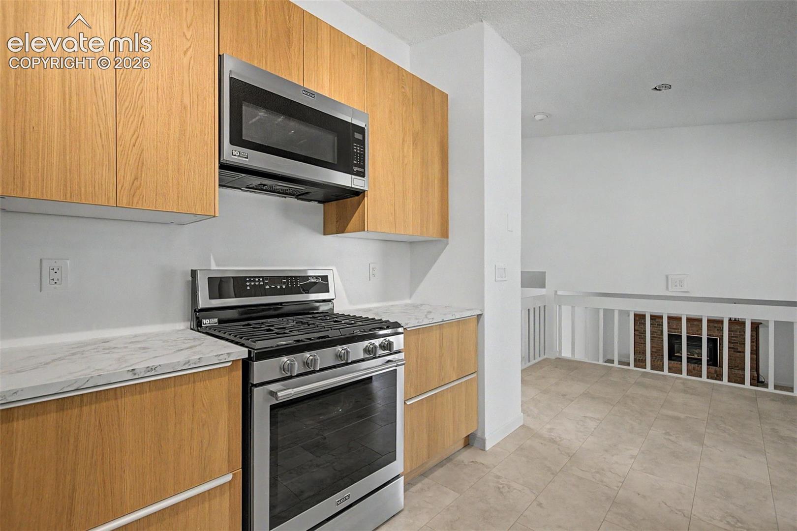 Gas Range and New Vented 1000w Microwave