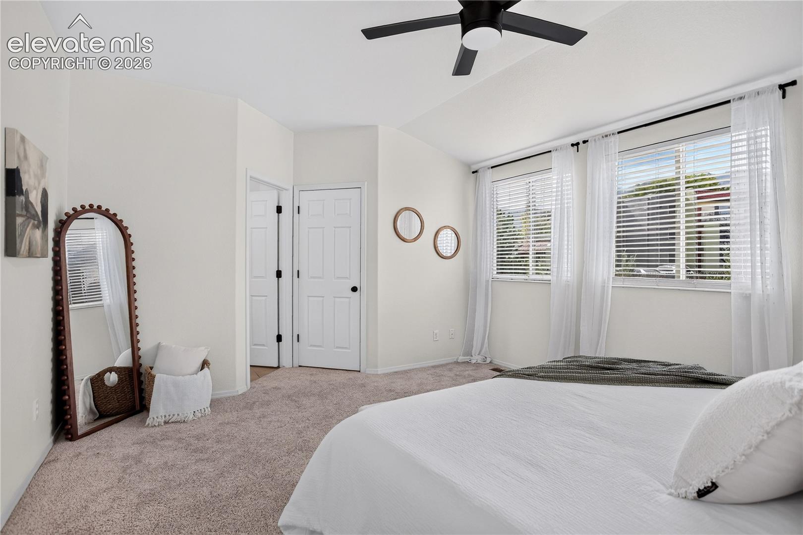 Primary (master) bedroom with ceiling fan.