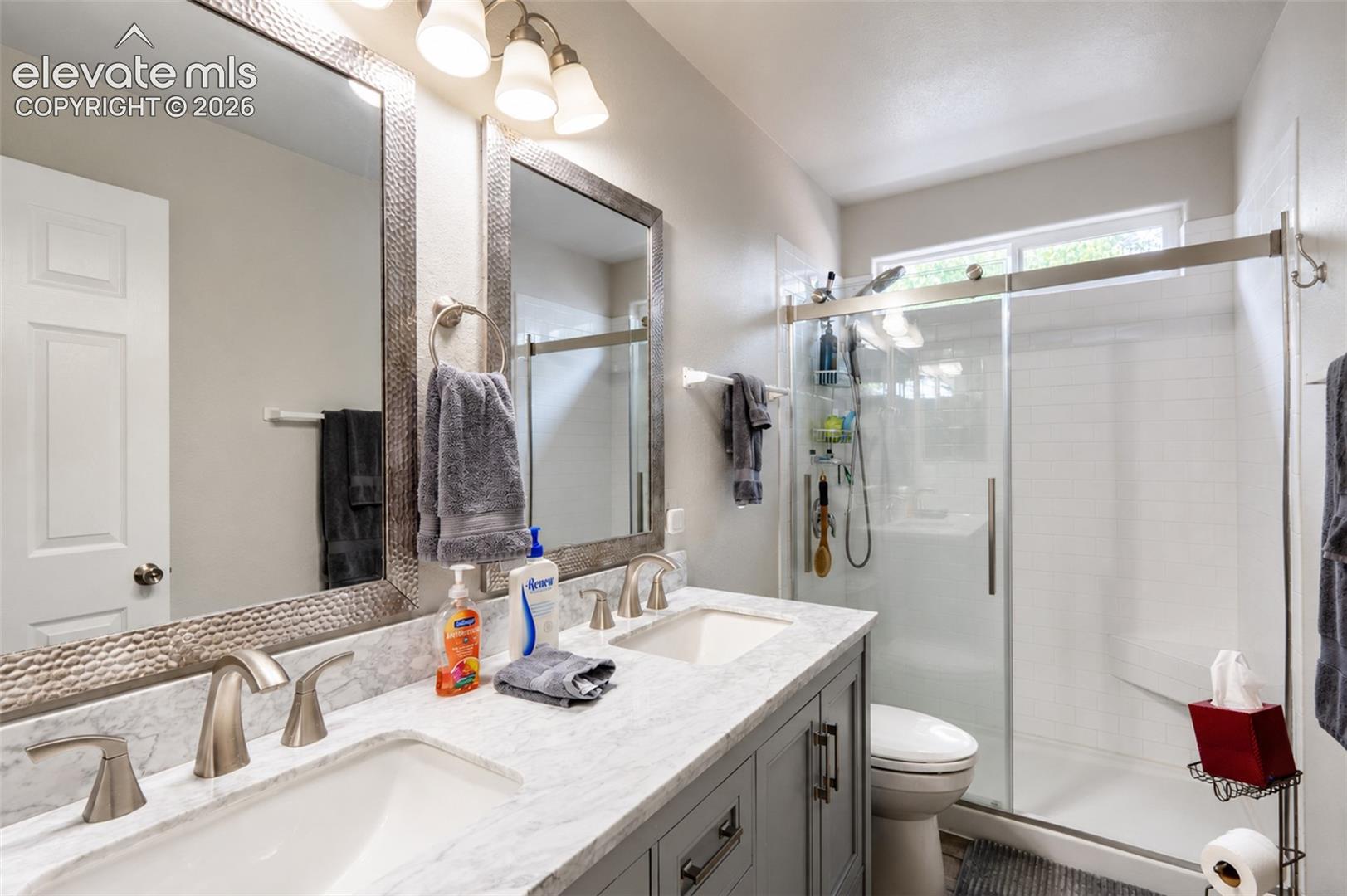 Ensuite primary full bathroom (2) with dual sinks