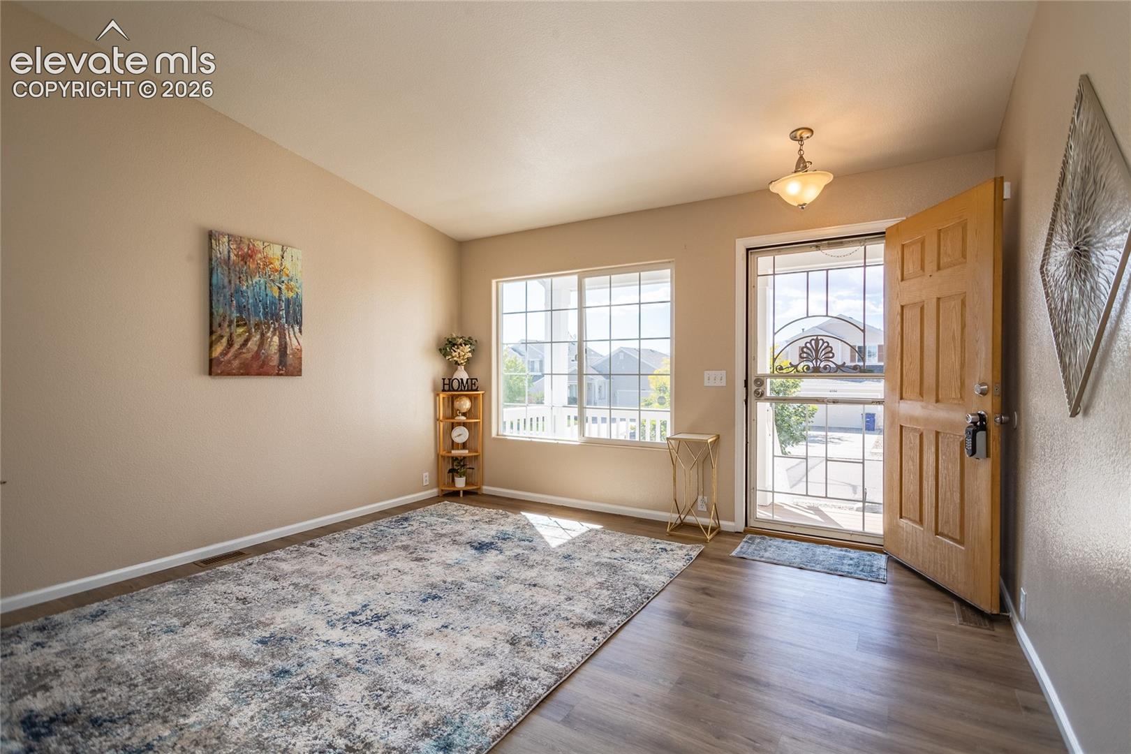 Large picture windows bathe the main living room in abundant natural light