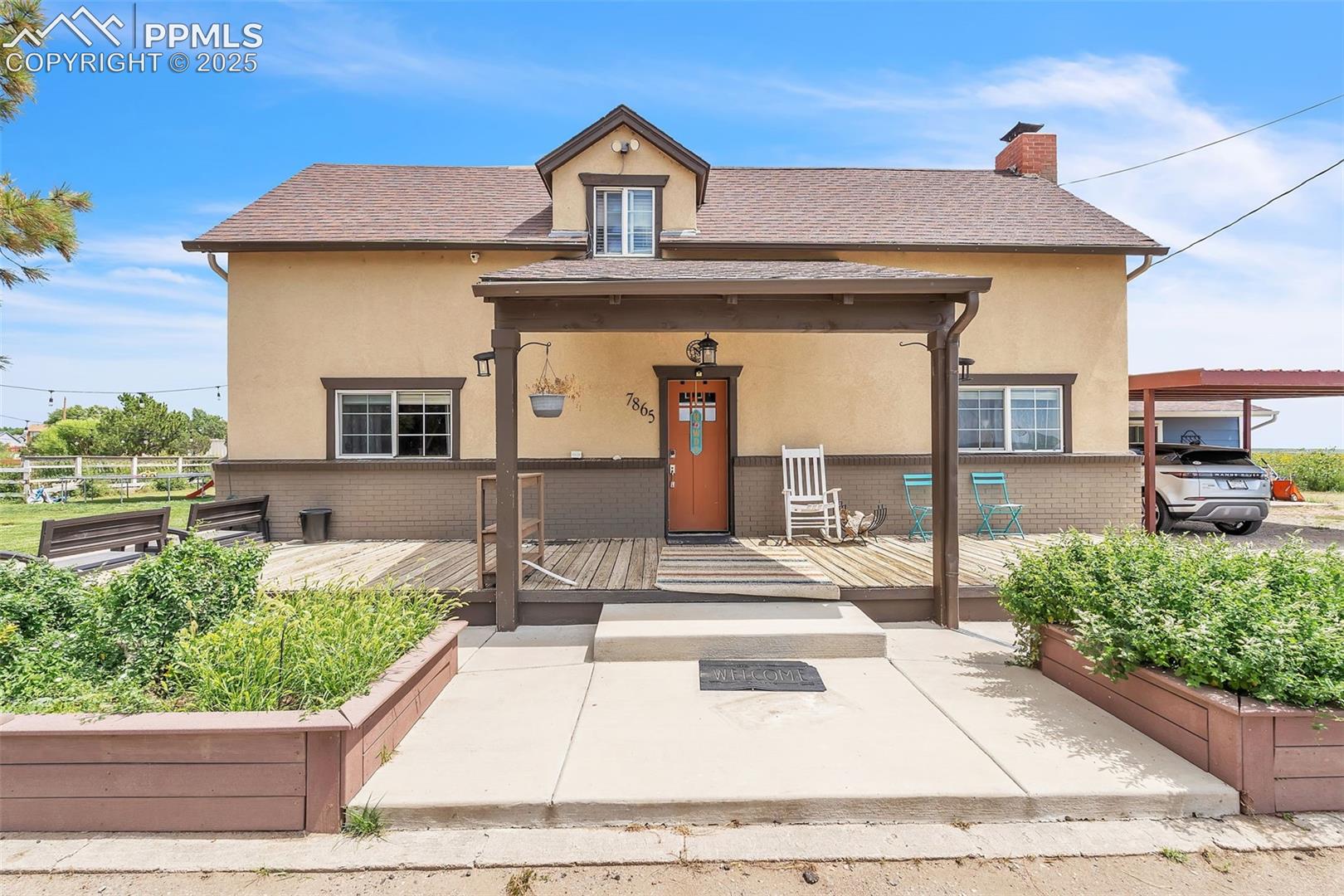 If you’re looking for acreage, this property delivers. The main home features a new roof and new A/C. Multiple outbuildings include a shed, chicken coop, two additional structures, and a large concrete pad ideal for basketball or other recreational use. The exterior is a combination of stucco and brick, complemented by a spacious wood front deck, partially covered for year-round enjoyment.Upon entry, wood flooring leads into a generous living room with a wood-burning fireplace, vinyl windows, a ceiling fan, and a convenient half bath.The kitchen offers wood-grain tile flooring, a sliding door to the backyard, pantry, granite countertops, and stainless steel appliances including a side-by-side refrigerator, microwave, dishwasher, and glass-top stove. Tile backsplash and a farmhouse sink enhance the space, along with a dedicated breakfast nook.Adjacent to the kitchen is a laundry room with a barn door, wet sink, front-loading Samsung units (included), and access to the basement (storage only). From the laundry room, walk out to a bonus apartment featuring a wood-grain tile entry, carpeted living areas, a spacious full bath with tile surround and wood-tile flooring, two bedrooms, and an efficiency-style kitchenette with sink. An electric heater provides comfort throughout.New LVP flooring on the stairs pairs with wrought-iron railing. The upper level includes four bedrooms and a three-quarter bath with tile surround, pebble-floor shower pan, and tile flooring. The large primary bedroom includes dormer appeal, LVP flooring, a walk-in closet, and a five-piece primary bath with soaking tub, tile flooring, oversized shower, and dual vanity.