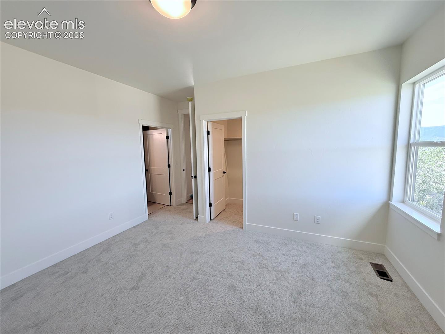 Bedroom 2 is a Jr. Suite with Private Full Bath located on the Main Level
