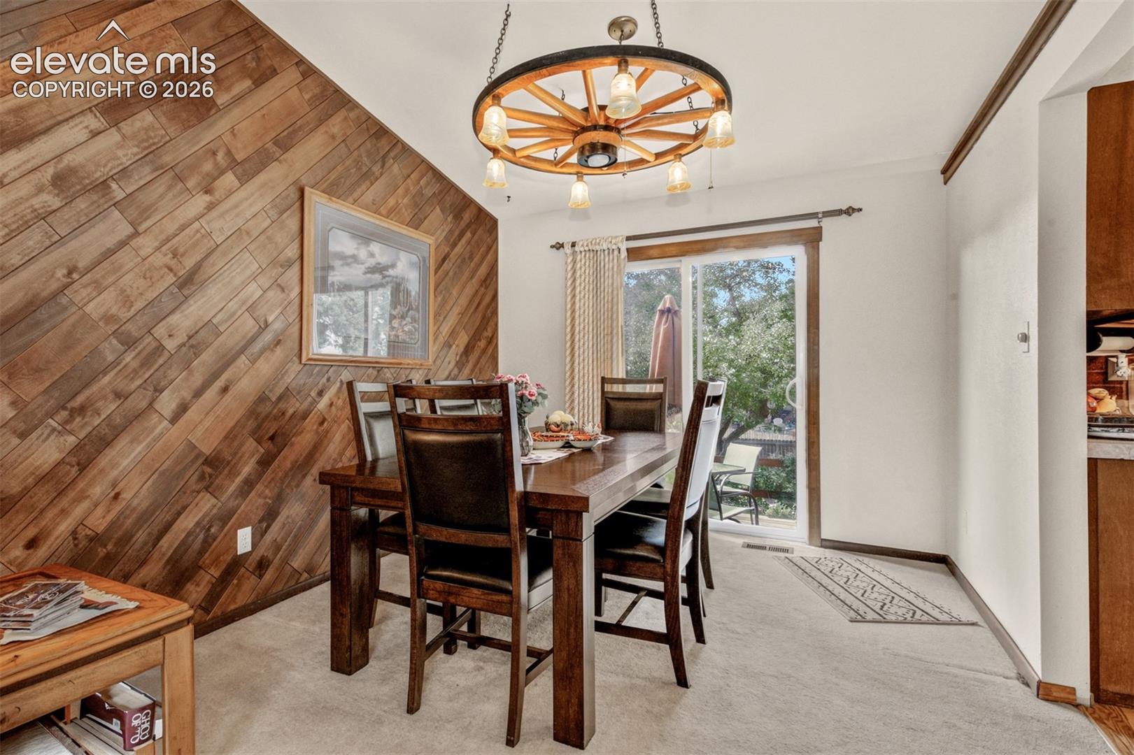 Spacious dining for family and friend with walkout to deck and rear yard.