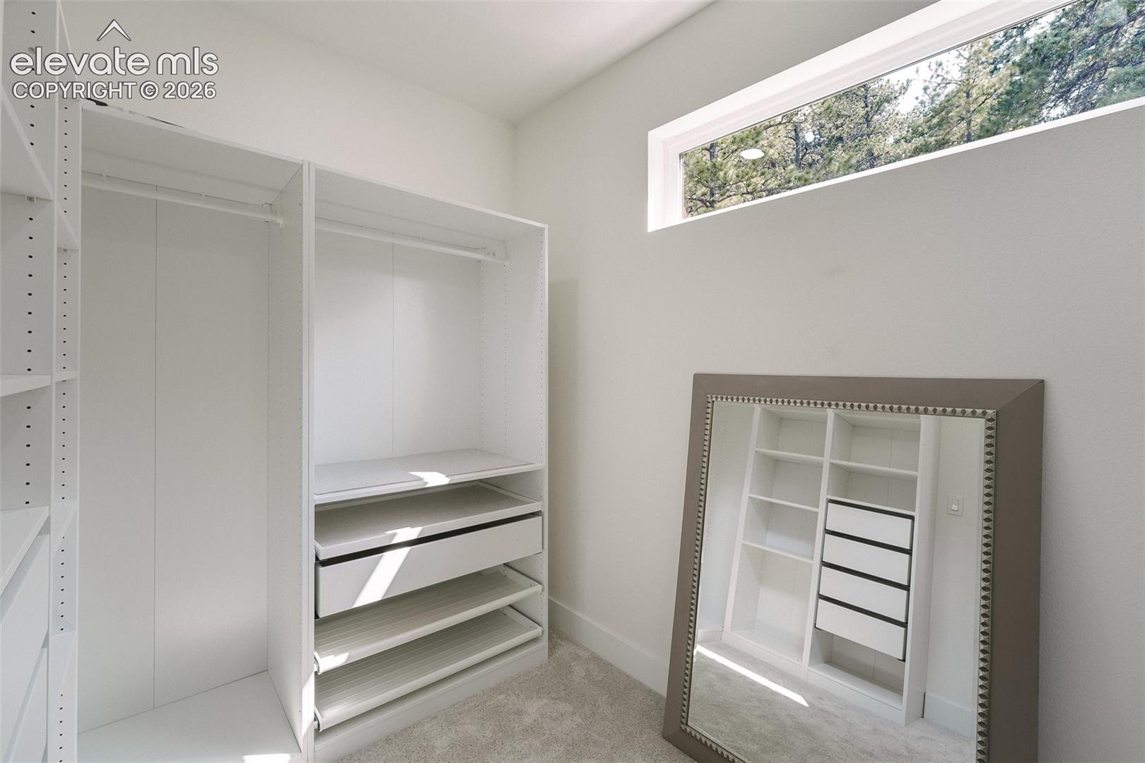 Spacious walk in closet with organizer in the upper level Primary Suite.