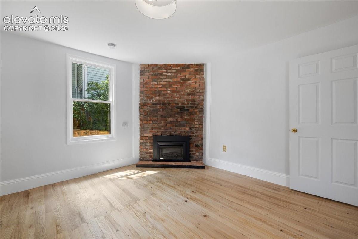 Vintage fireplace in 1 of the 3 bedrooms