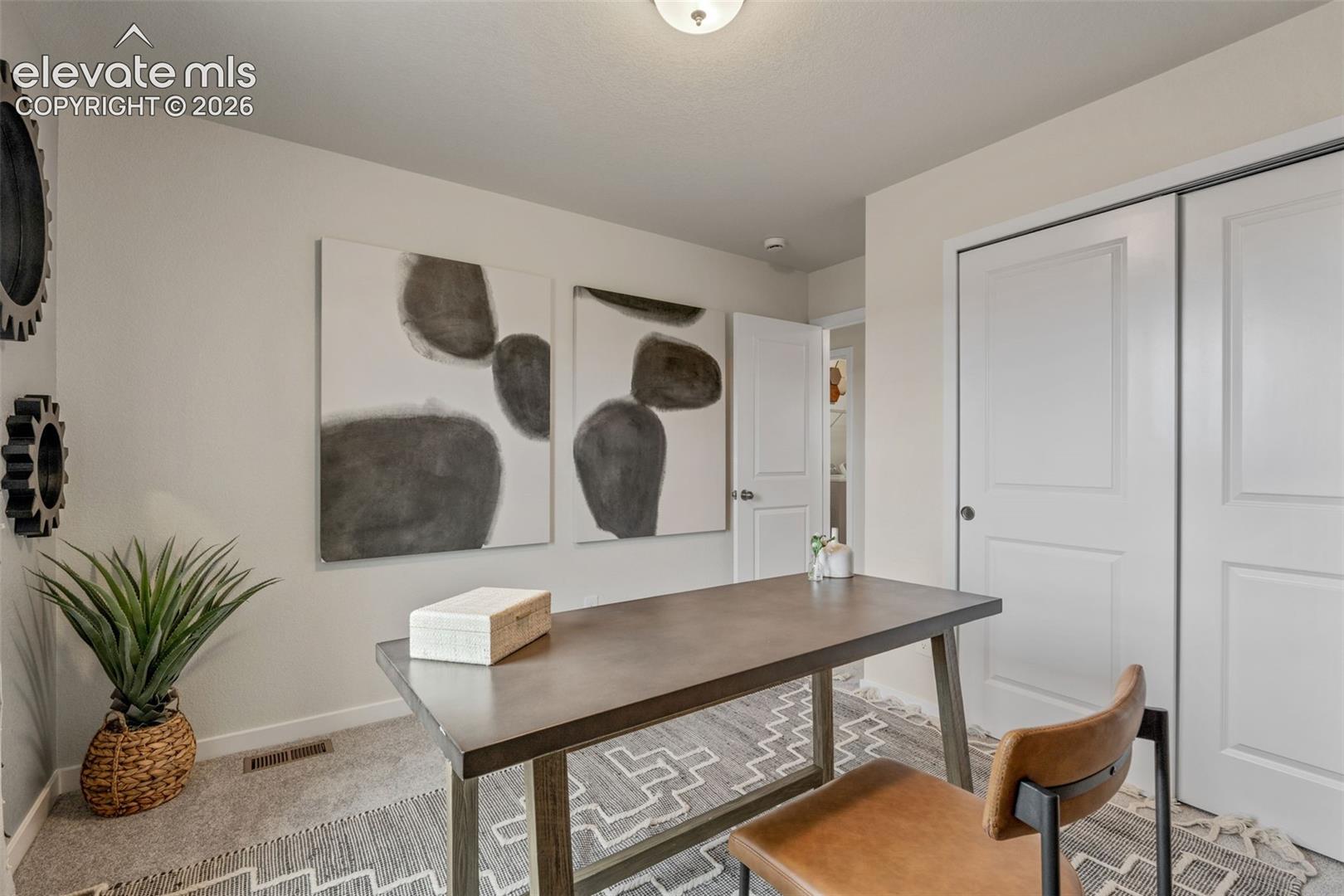 Recessed lighting, light gray wall paint, carpeting, and white paneled doors