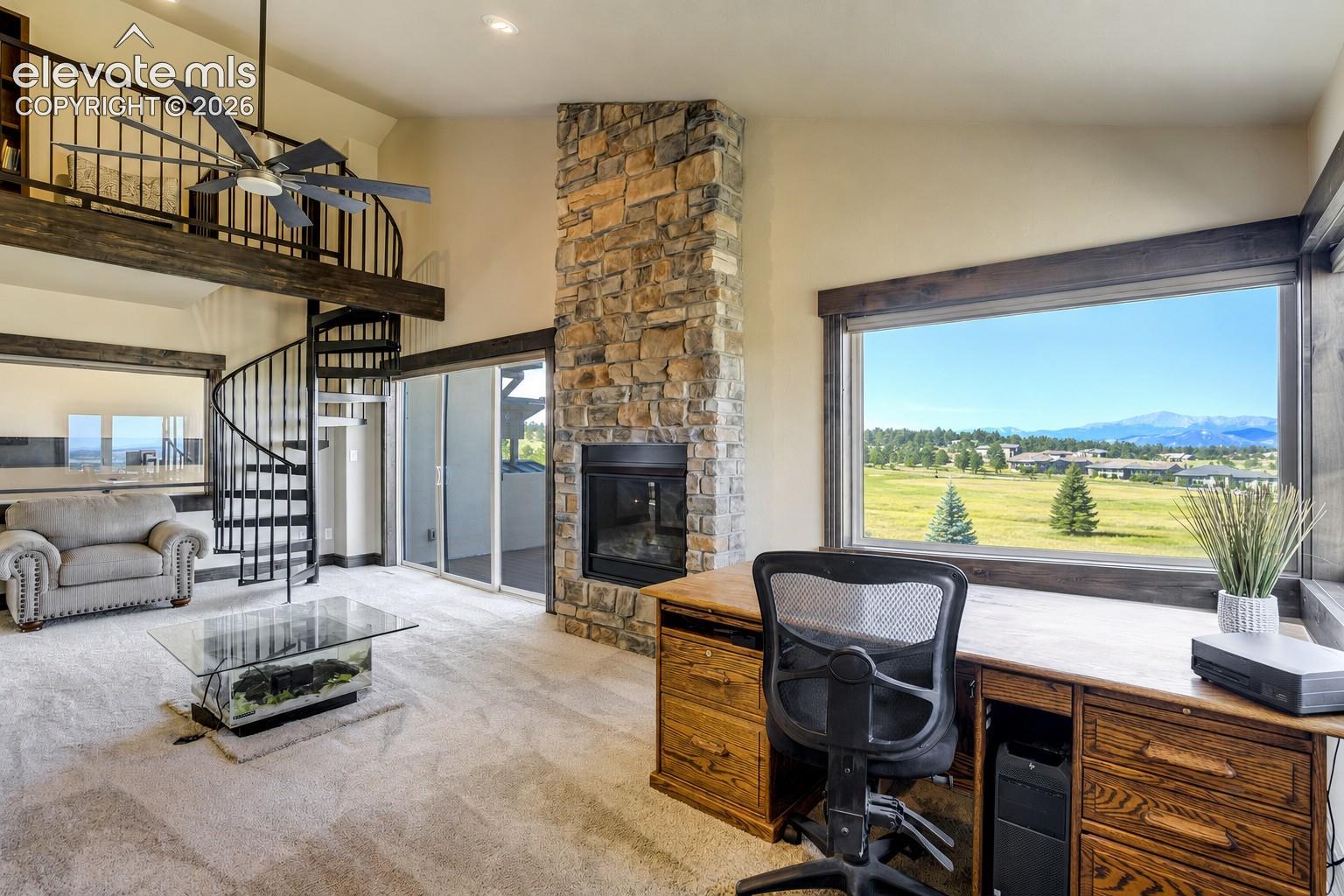 2nd floor Family/Flex room with lofted reading nook, private deck, gas fireplace, and Pikes Peak Views
