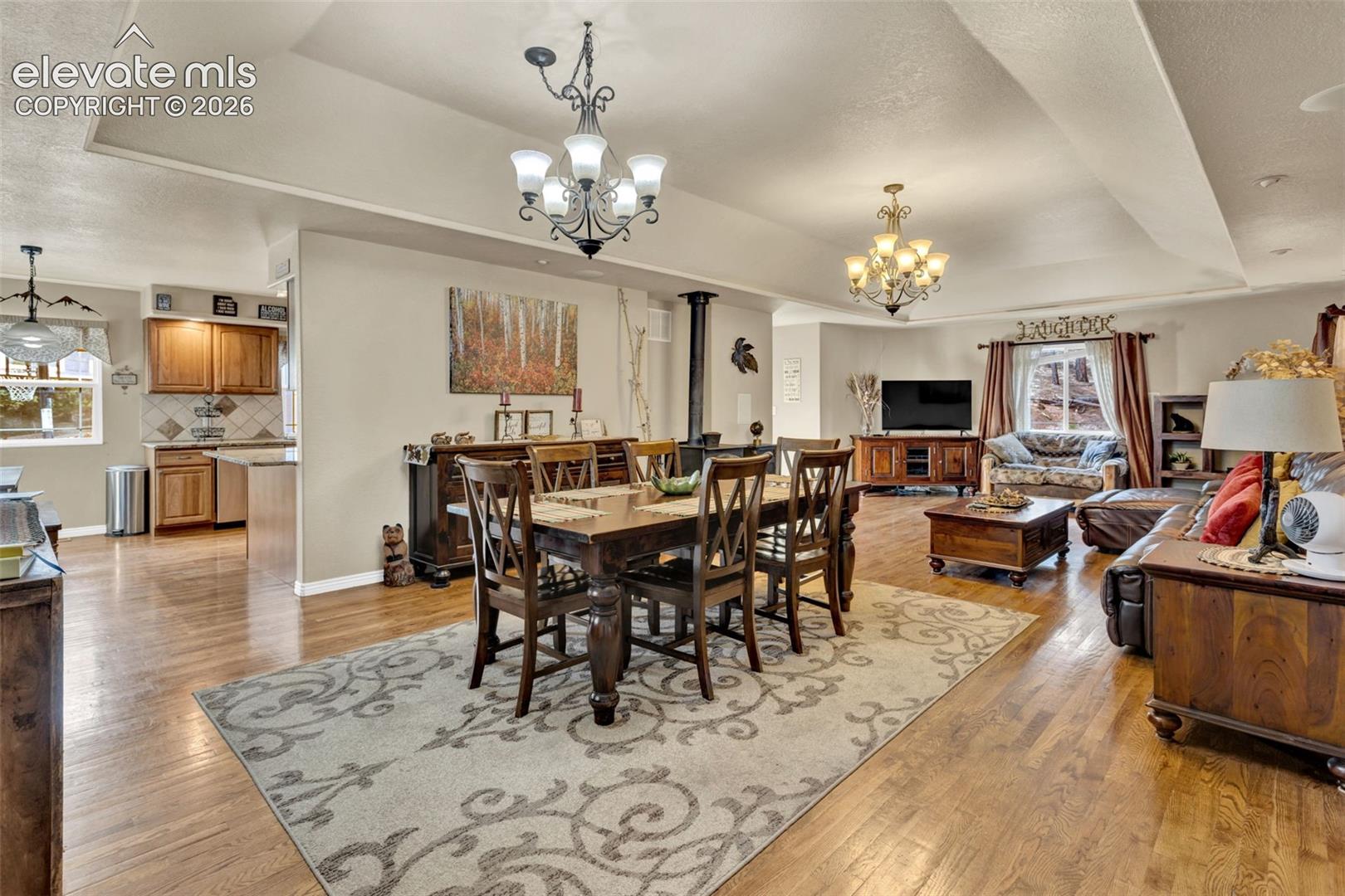 Welcome to the openness of dining, living room, and kitchen