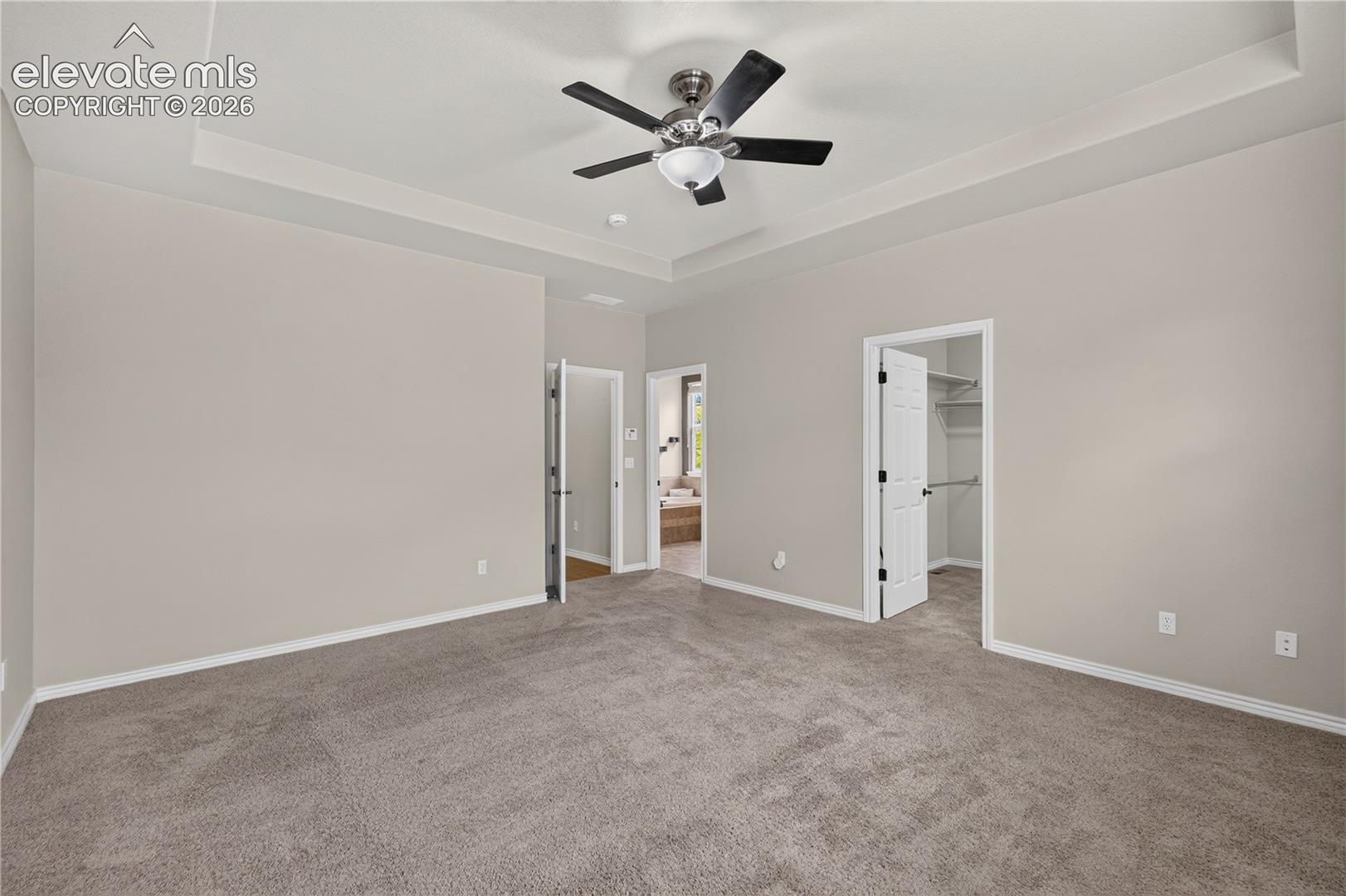 Primary bedroom with a large walk-in closet