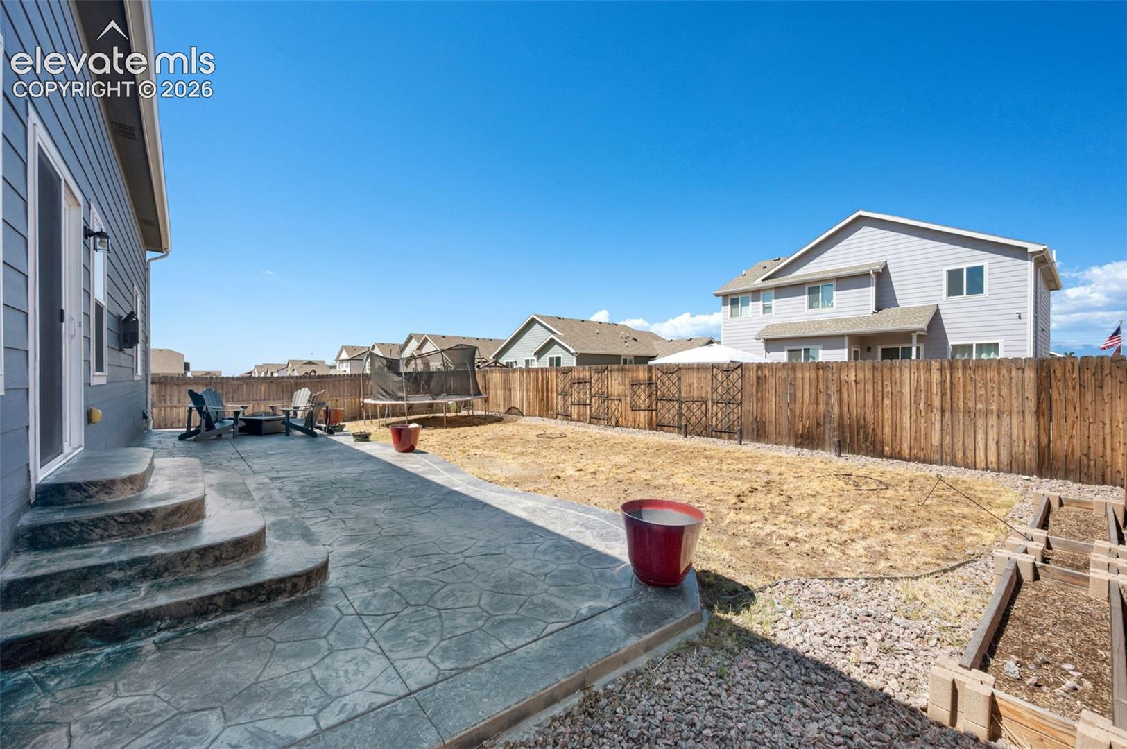Enjoy a barbecue on the patio in your fenced back yard