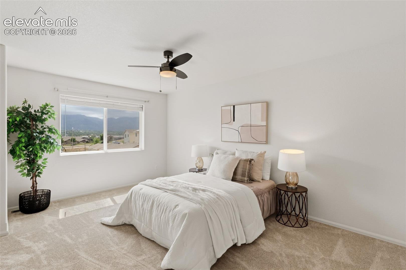 Wake up to stunning mountain views every morning from the comfort of your spacious primary bedroom