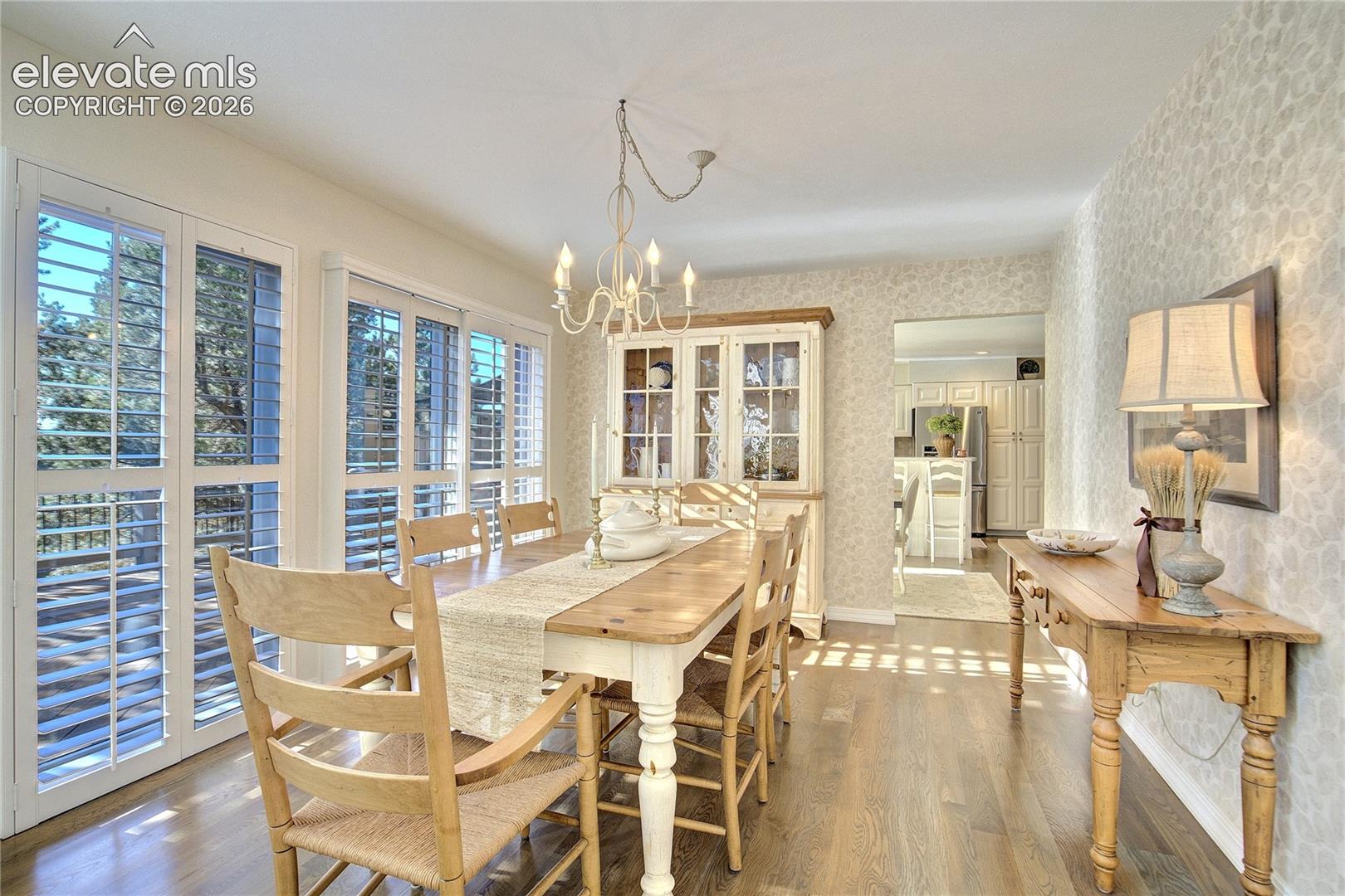 The formal dining room opens directly to the Brazilian Ipe deck, effortlessly extending gatherings outdoors.