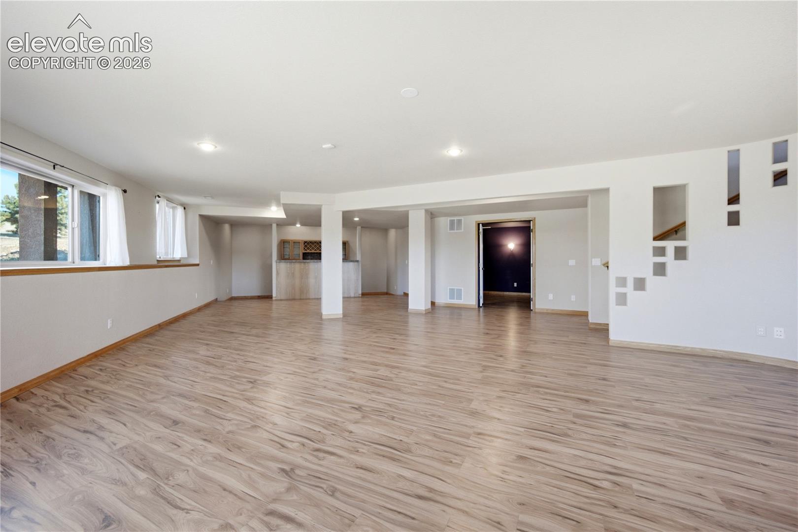 Game Room with wet bar and adjacent theater room