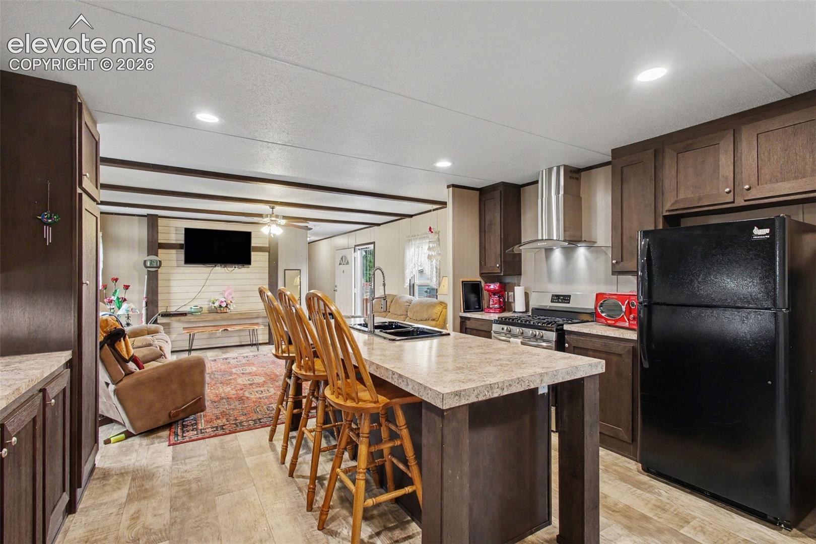 2nd Home: Functional center island adds extra workspace and a convenient gathering spot, complementing the modern kitchen layout.