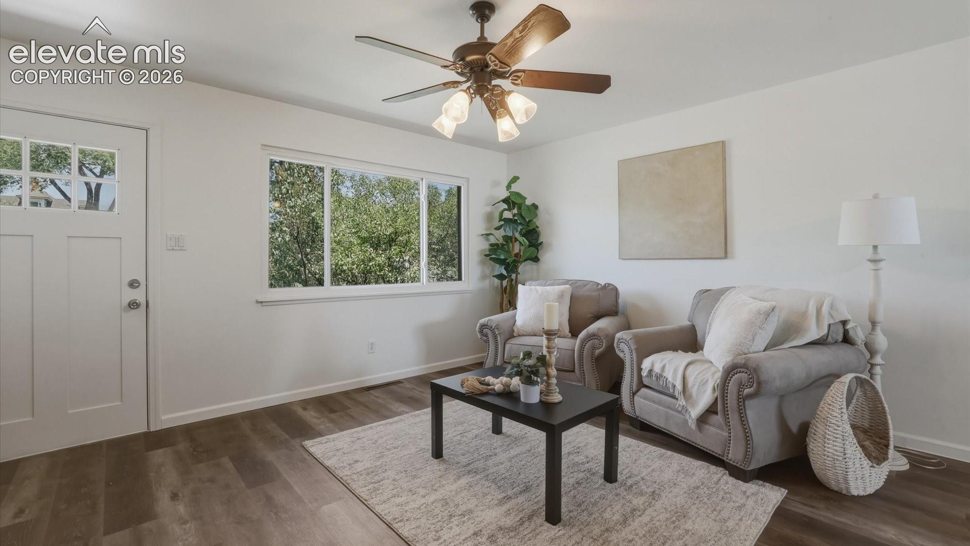 The Living Room has beautiful bamboo flooring and front yard views.