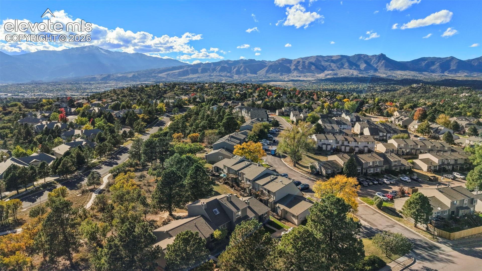 Aerial perspective featuring mountainous terrain and expansive natural landscape surroundings