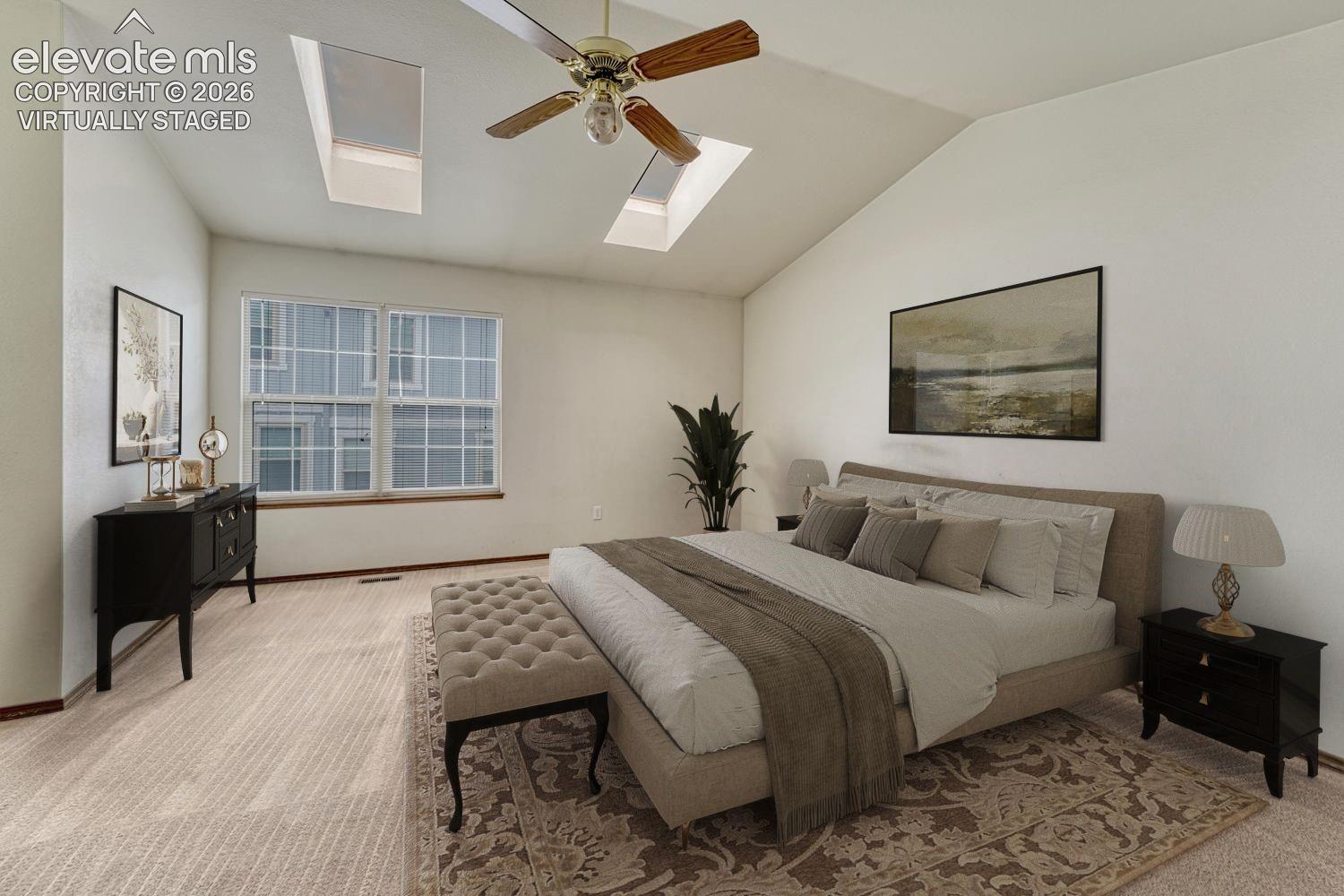 Skylights let in abundant natural light. Virtually staged.