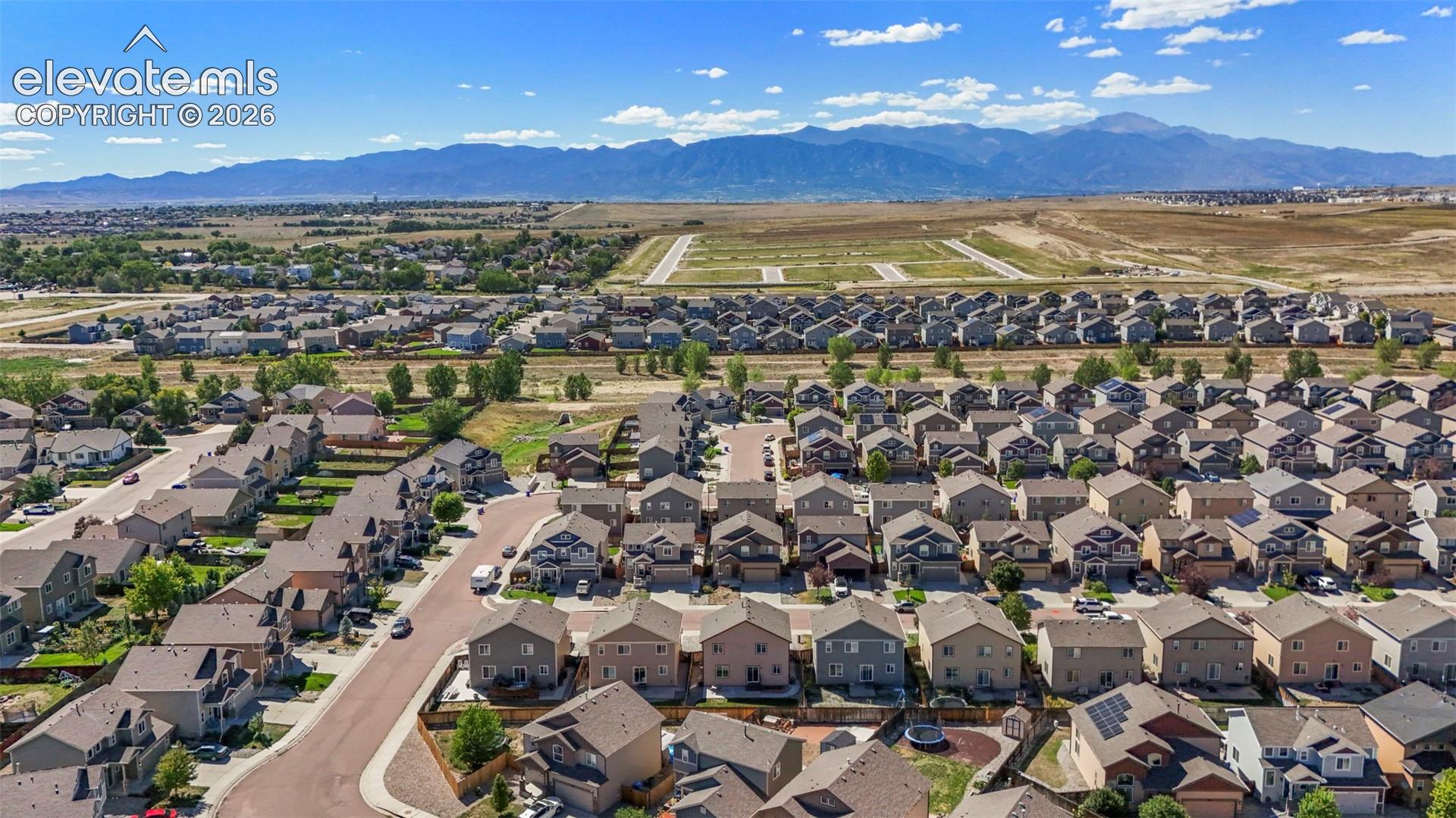 Expansive residential neighborhood with distant mountain range
