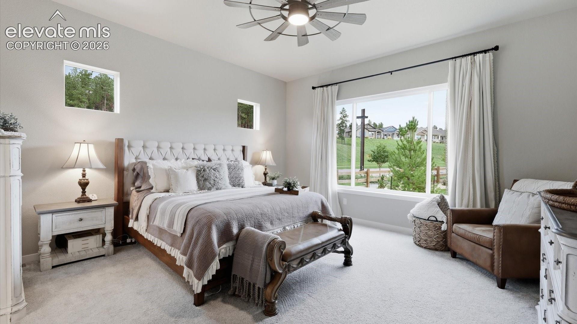 A SERENE MAIN-LEVEL RETREAT — This spacious main-level retreat pairs spectacular views with a private en-suite bath, creating an elegant and peaceful escape