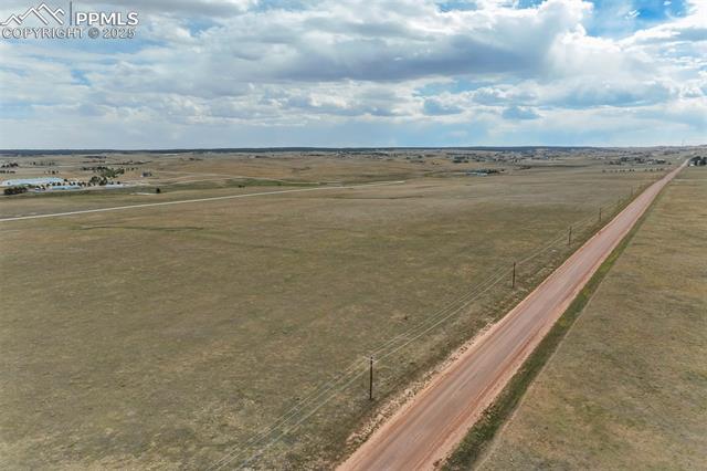 Birds eye view of property with a rural view