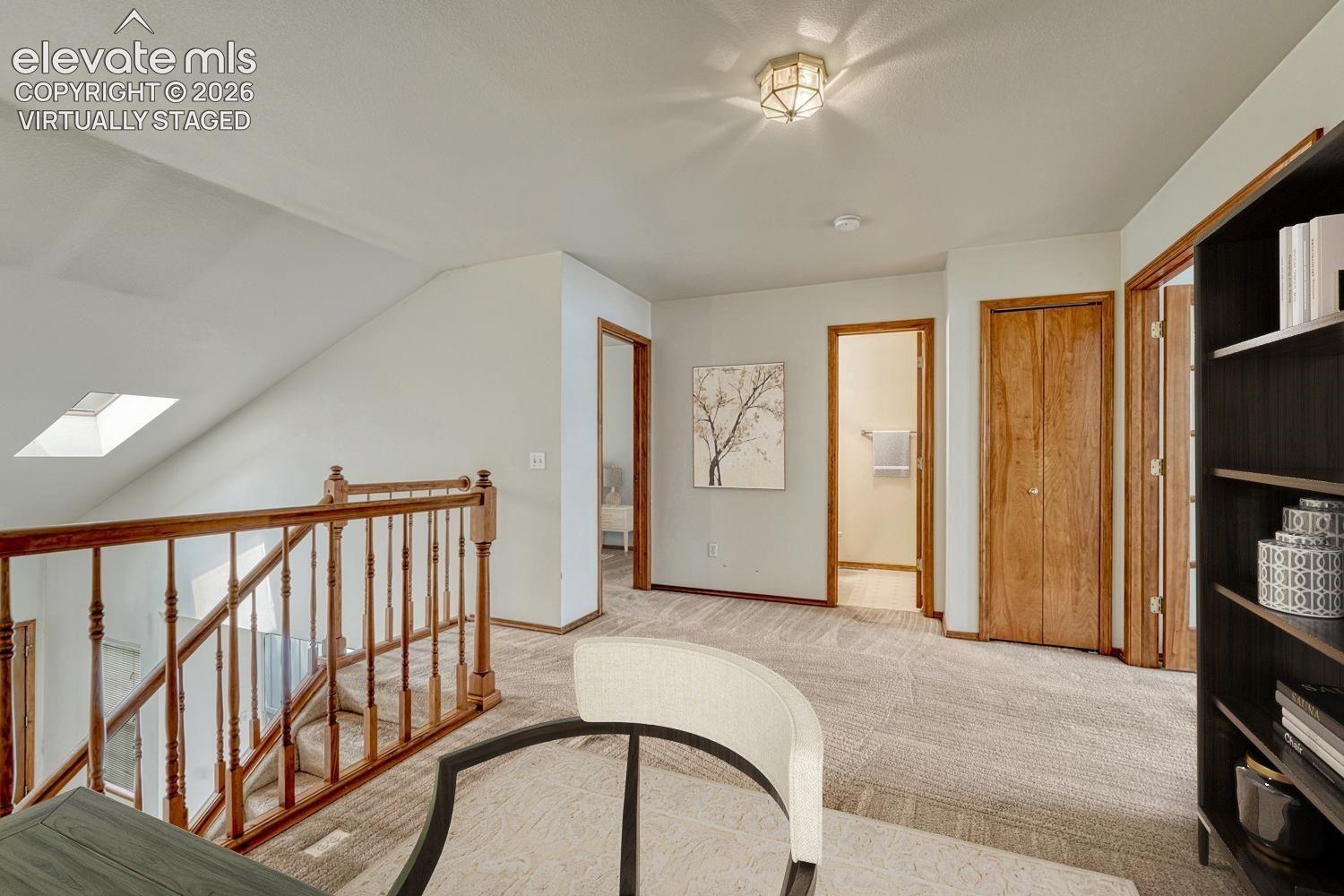 Spacious loft overlooks the living room. Virtually staged.