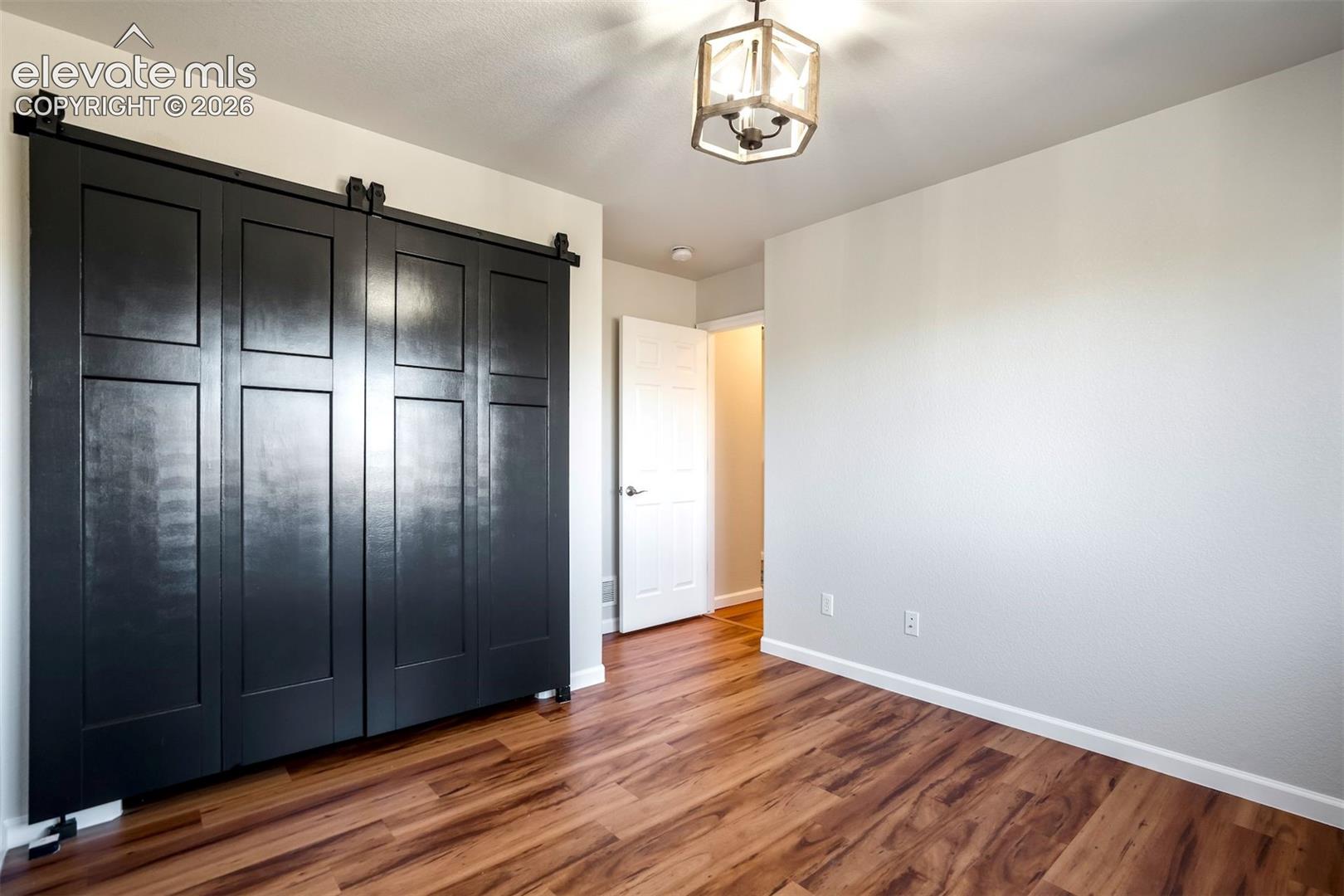 Bedroom 2 upstairs with folding barn doors. 