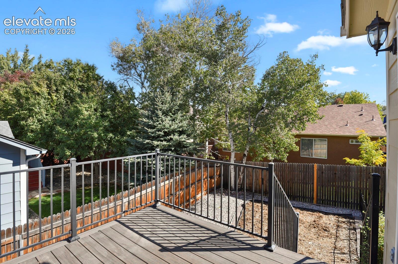 Composite decking with dark metal railings